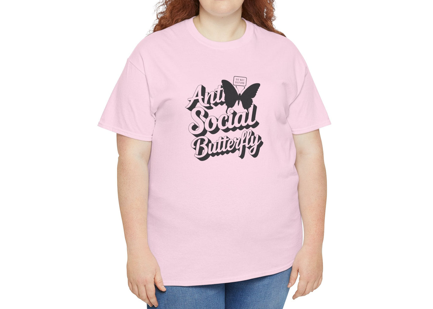 Woman modeling light pink Anti-Social Butterfly T-shirt with casual smile. Outgoing energy? Not today. Part of the Vivid Divergence Memewear Collection!