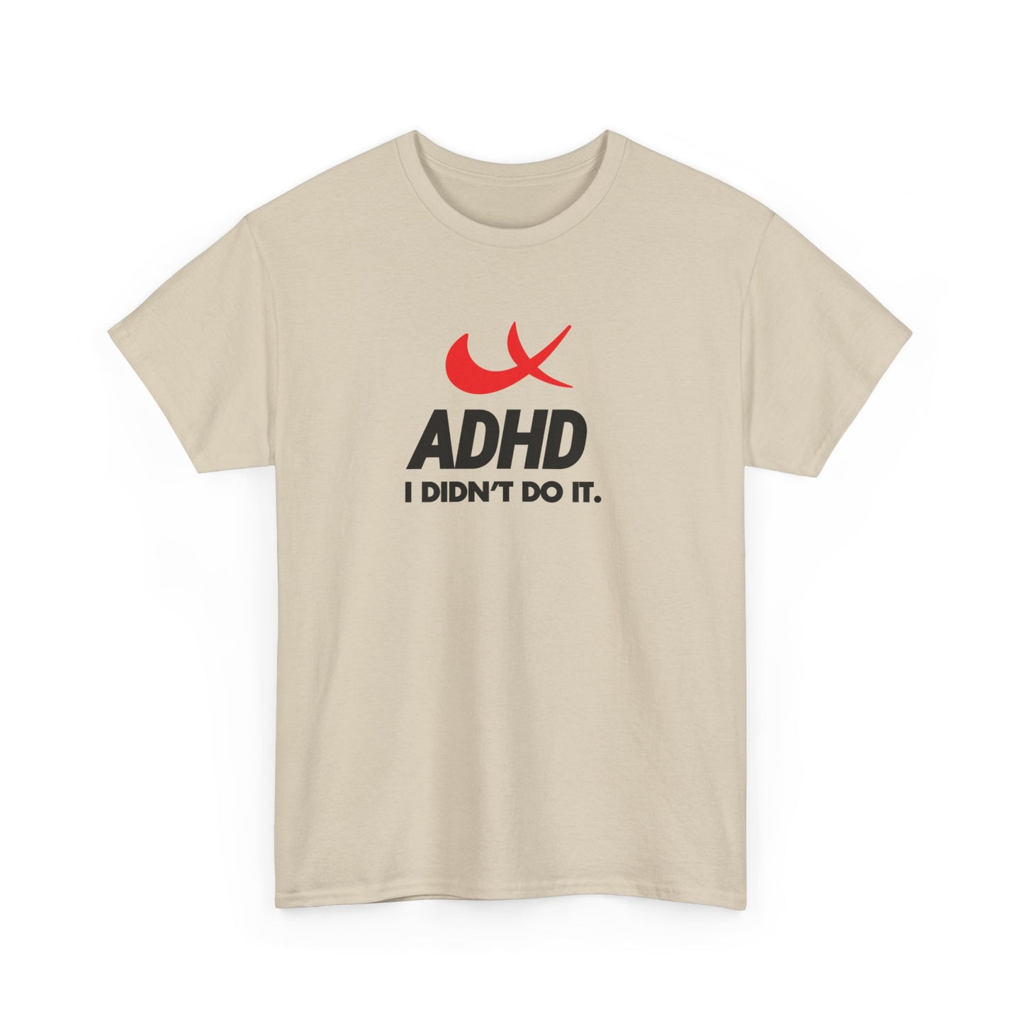 Front view of a beige T-shirt with the phrase "ADHD I Didn't Do It" and a red swoosh parody of the Nike symbol. Part of the Vivid Divergence Sensory Friendly Unisex Tees Range.