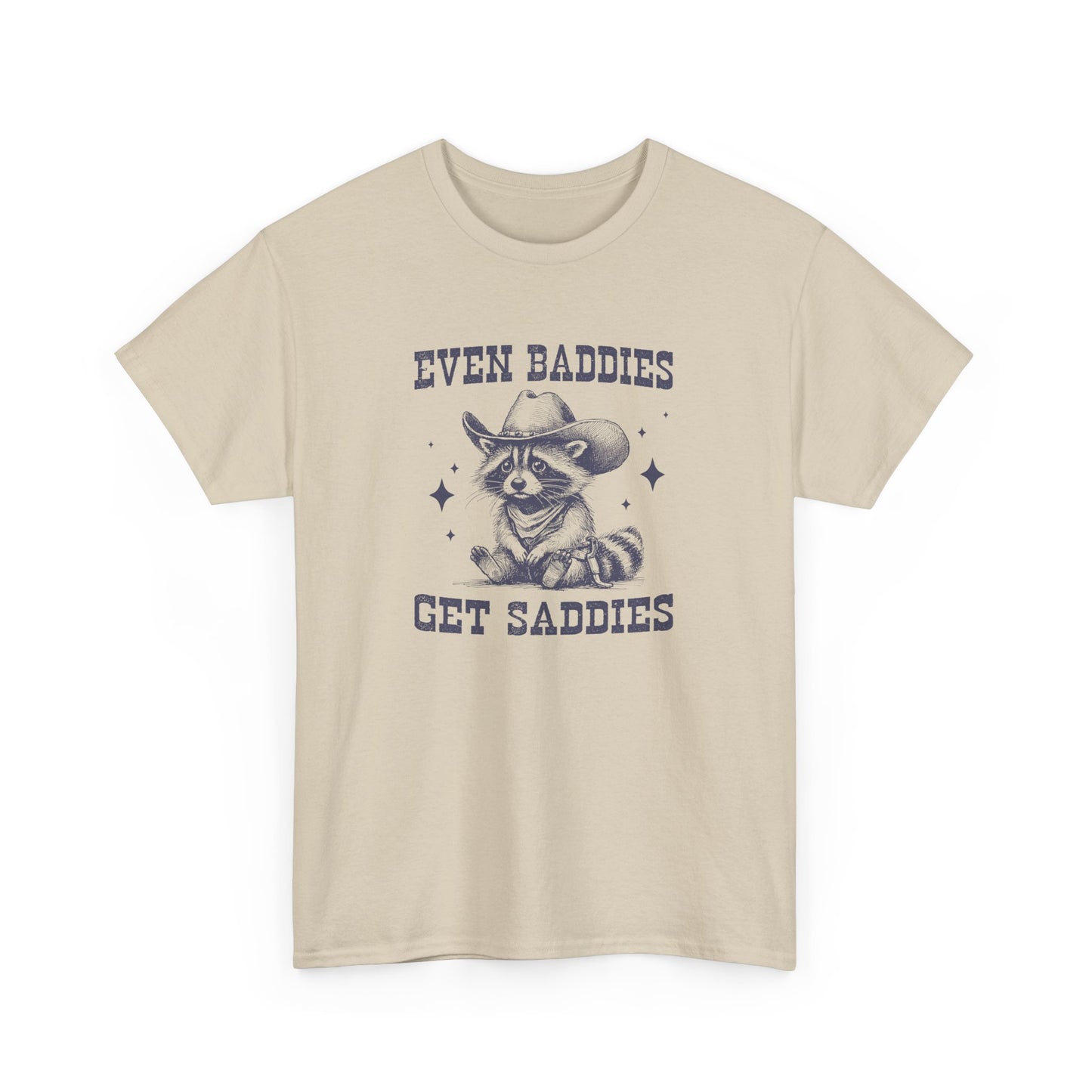 Front view of a beige T-shirt with the text "Even Baddies Get Saddies" and a crying eye graphic. Part of the Vivid Divergence Sensory Friendly Unisex Tees Range.
