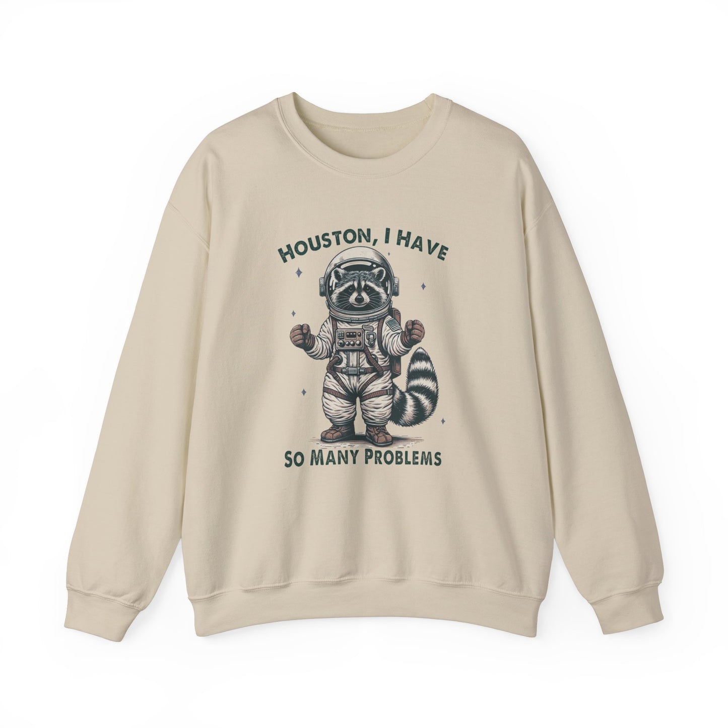 Front view of a beige sweater jumper with the text "Houston, I Have So Many Problems" and a cartoon raccoon illustration holding a striped object. Part of the Vivid Divergence Sensory Friendly Unisex Sweater Jumper Range.