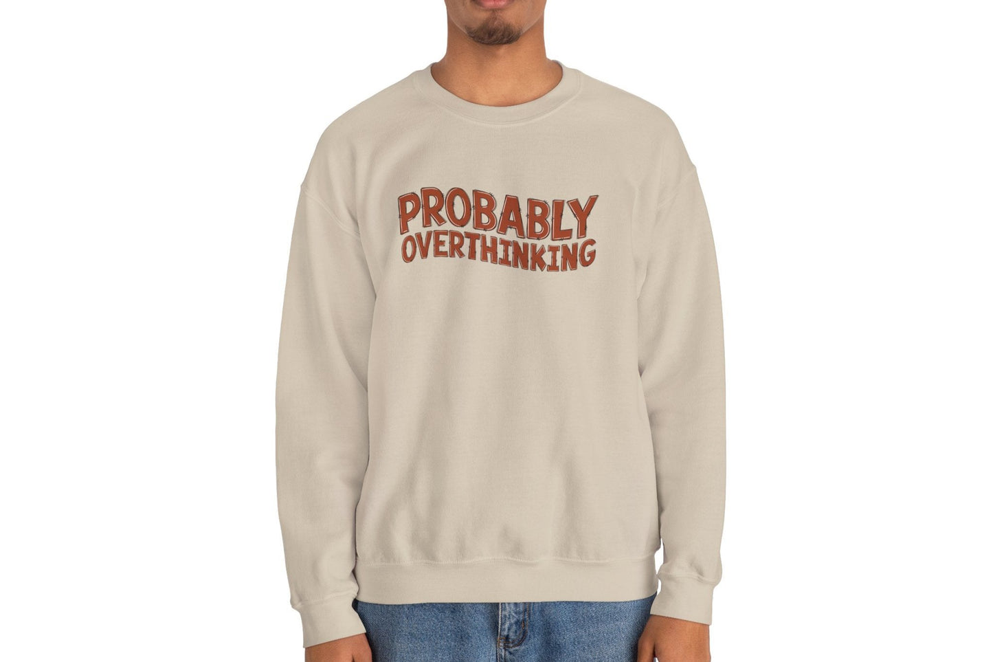 Model wearing a beige sweater jumper with the text "Probably Overthinking" in bold red lettering. Part of the Vivid Divergence Sensory Friendly Unisex Sweater Jumper Range.