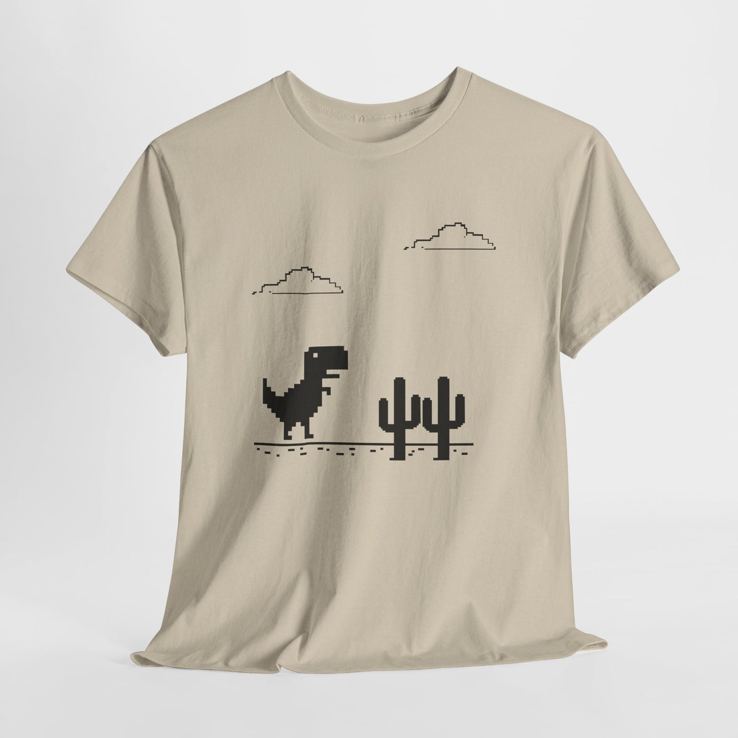 Hanging beige T-shirt featuring a minimalist pixel-style T-Rex Runner Dinosaur Game design with a T-Rex, cacti, and clouds. Part of the Vivid Divergence Sensory Friendly Unisex Tees Range.