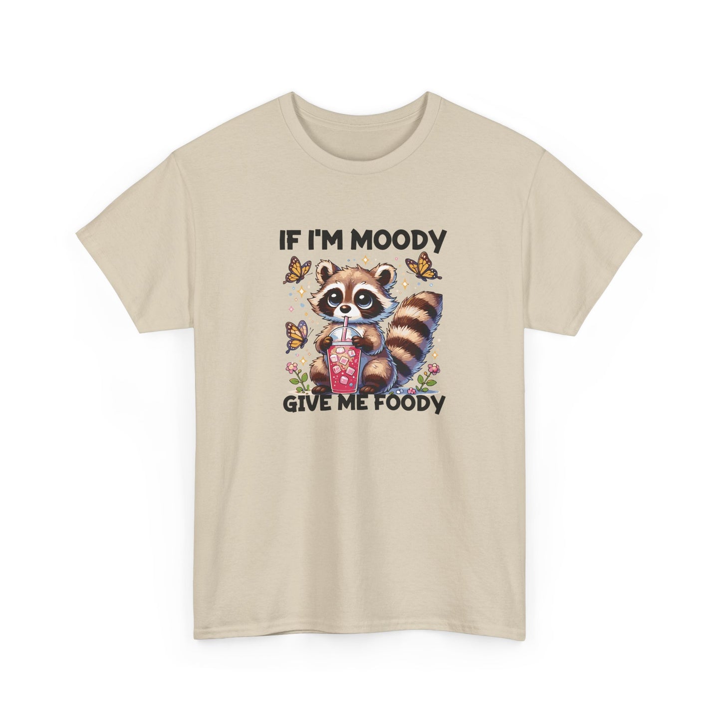 Front view of a beige T-shirt featuring a raccoon graphic with food and the text "If I'm Moody, Give Me Foody." Part of the Vivid Divergence Sensory Friendly Unisex Tees Range.