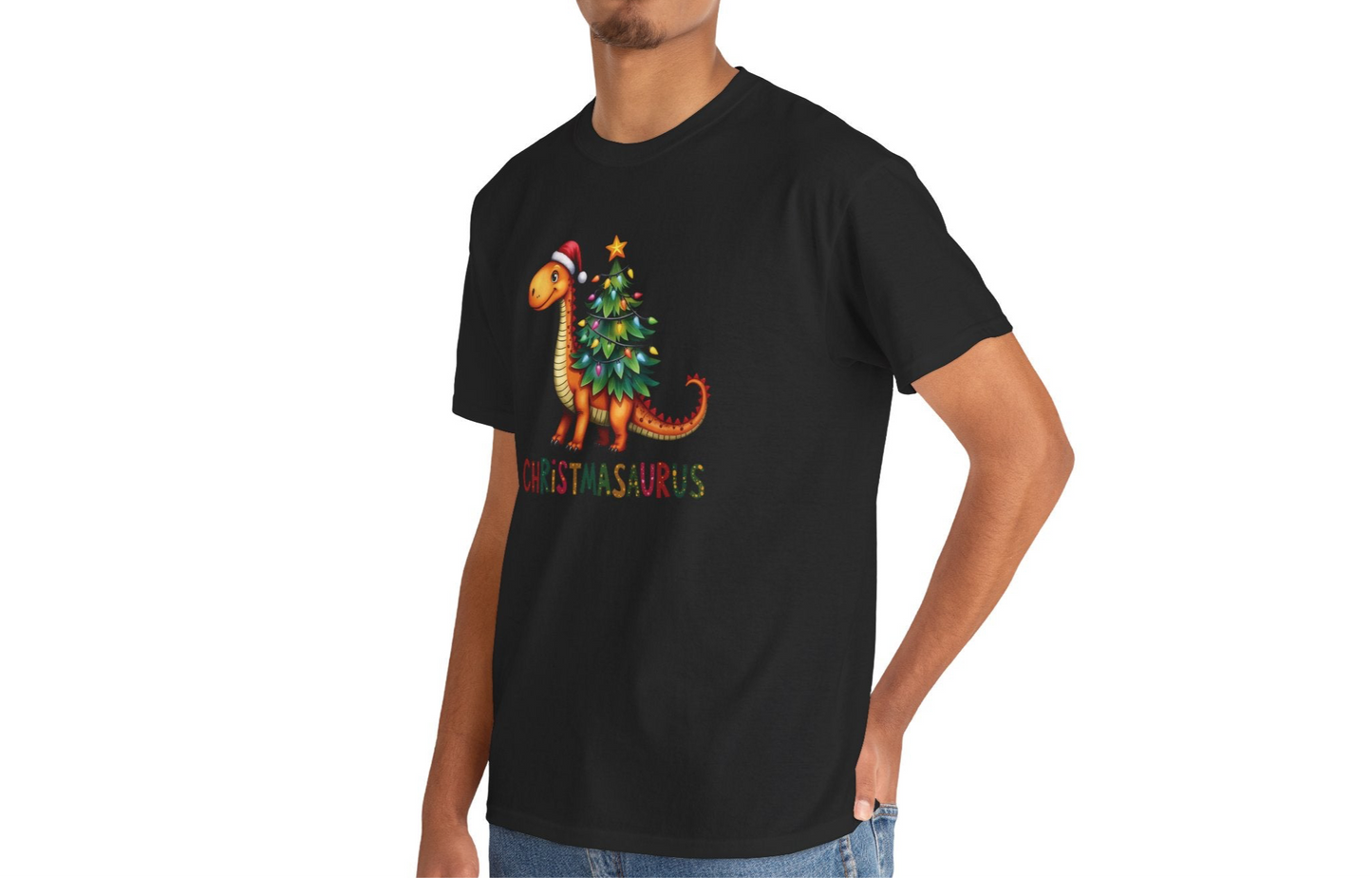 Model wearing a black T-shirt featuring a festive dinosaur decorated as a Christmas tree with ornaments and lights, styled casually for the holiday season. Part of the Vivid Divergence Sensory Friendly Unisex Tees Range.