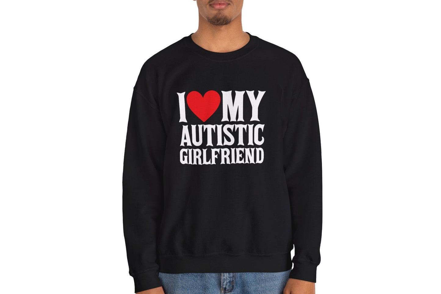 Model wearing a black sweater jumper with the text "I ❤️ My Autistic Girlfriend" in bold white and red lettering. Part of the Vivid Divergence Sensory Friendly Unisex Sweater Jumper Range.
