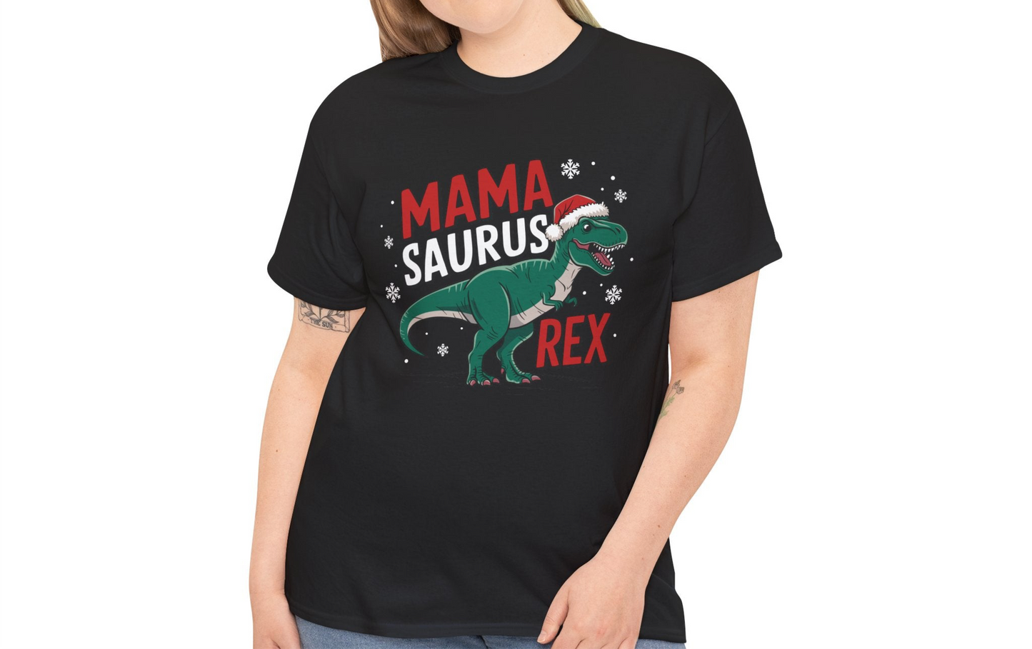 Model wearing a black T-shirt featuring a "Mama-Saurus Rex" design with a festive dinosaur illustration, styled casually. Part of the Vivid Divergence Sensory Friendly Unisex Tees Range.