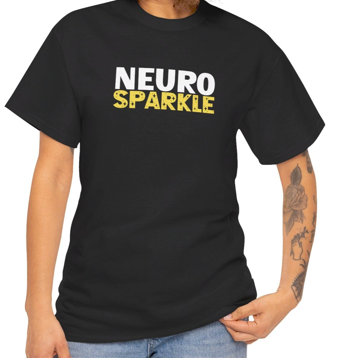 Model wearing a black T-shirt with "Neurosparkle" in bold white and yellow text. Part of the Vivid Divergence Sensory Friendly Unisex Tees Range.
