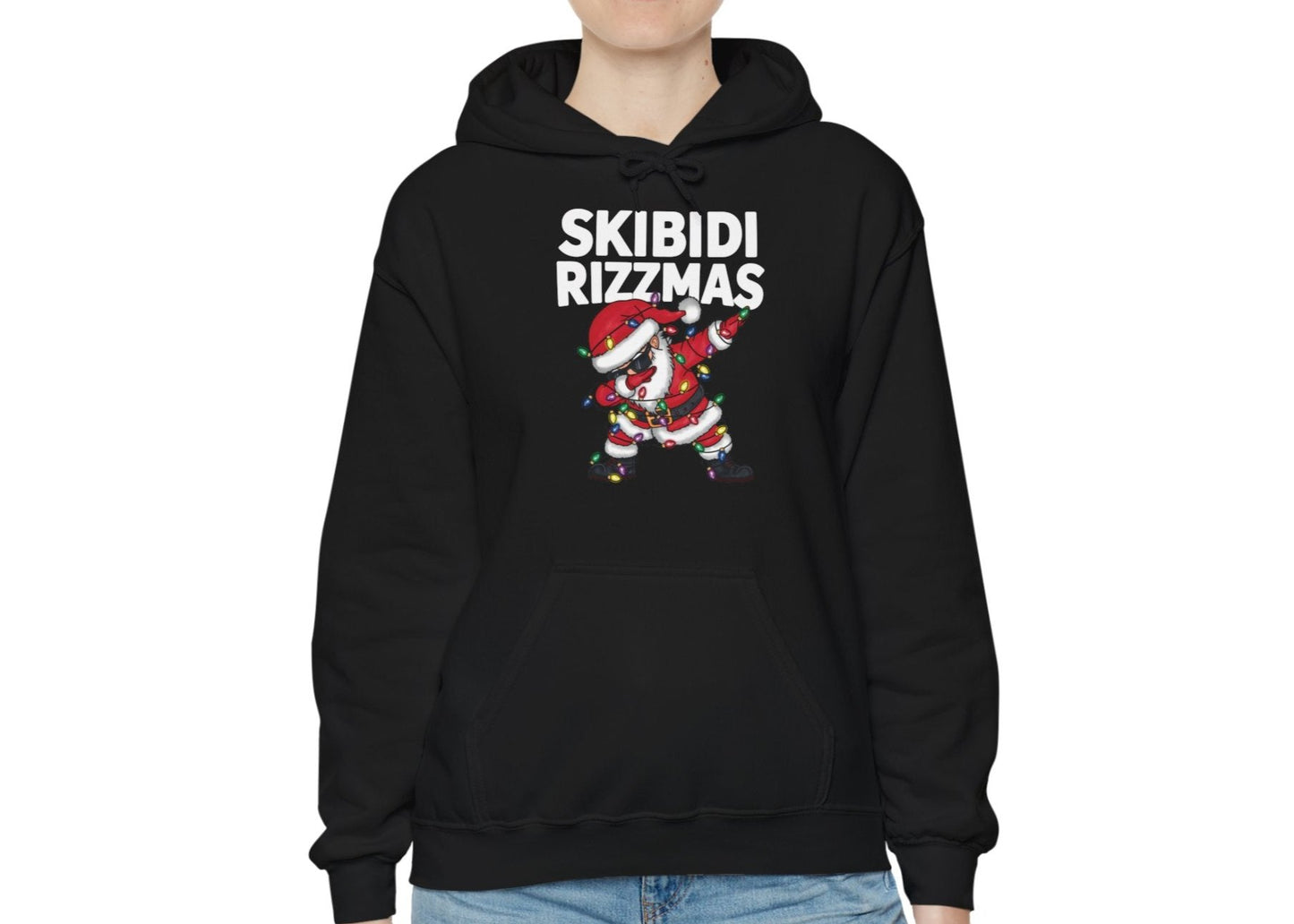 Model wearing a black "Skibidi Rizzmas" hoodie with a dabbing Santa design. Part of the Vivid Divergence Sensory Friendly Unisex Hoodies Range.