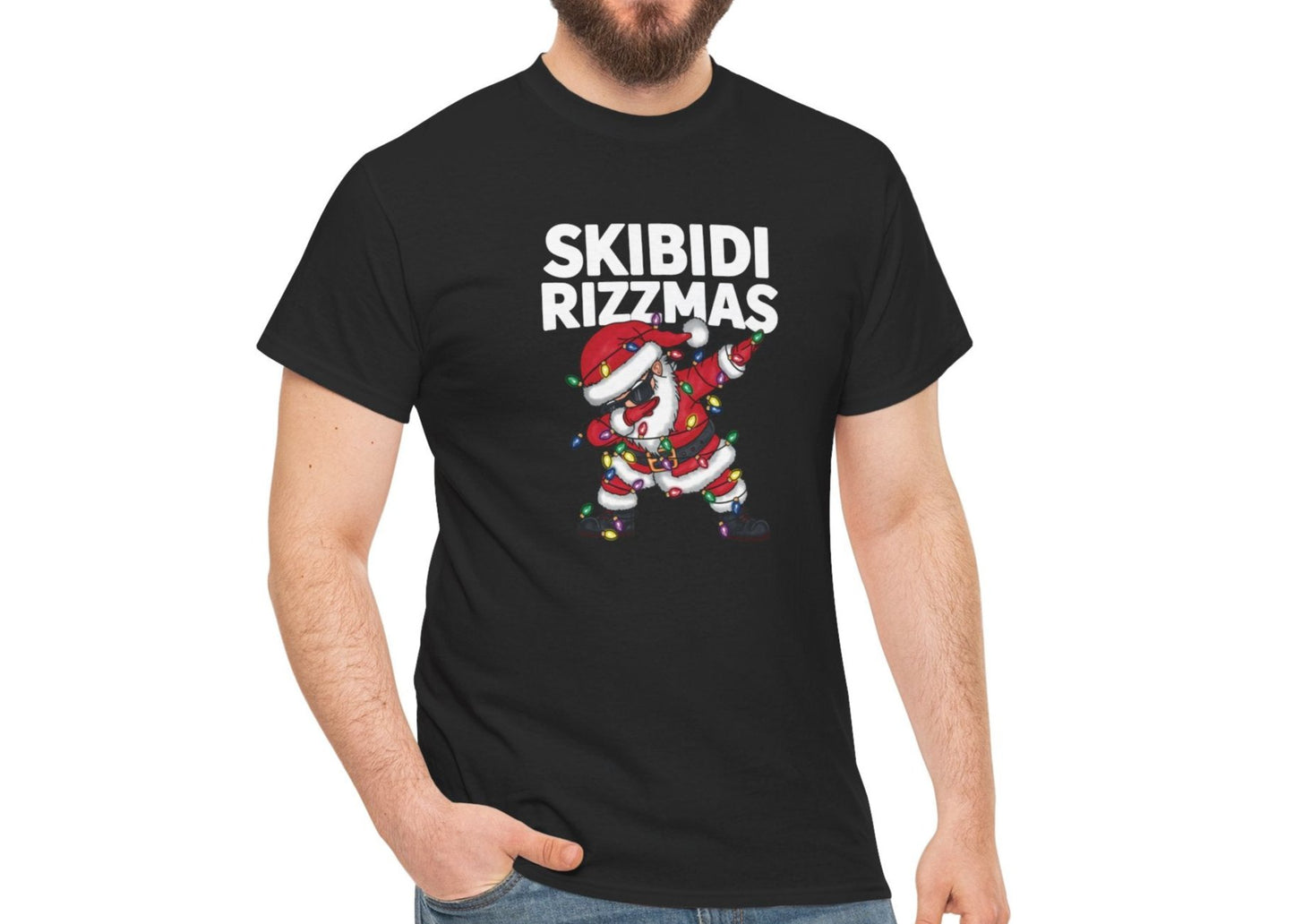 Model wearing a black T-shirt with a dabbing Santa and "Skibidi Rizzmas" text. Part of the Vivid Divergence Sensory Friendly Unisex Tees Range.