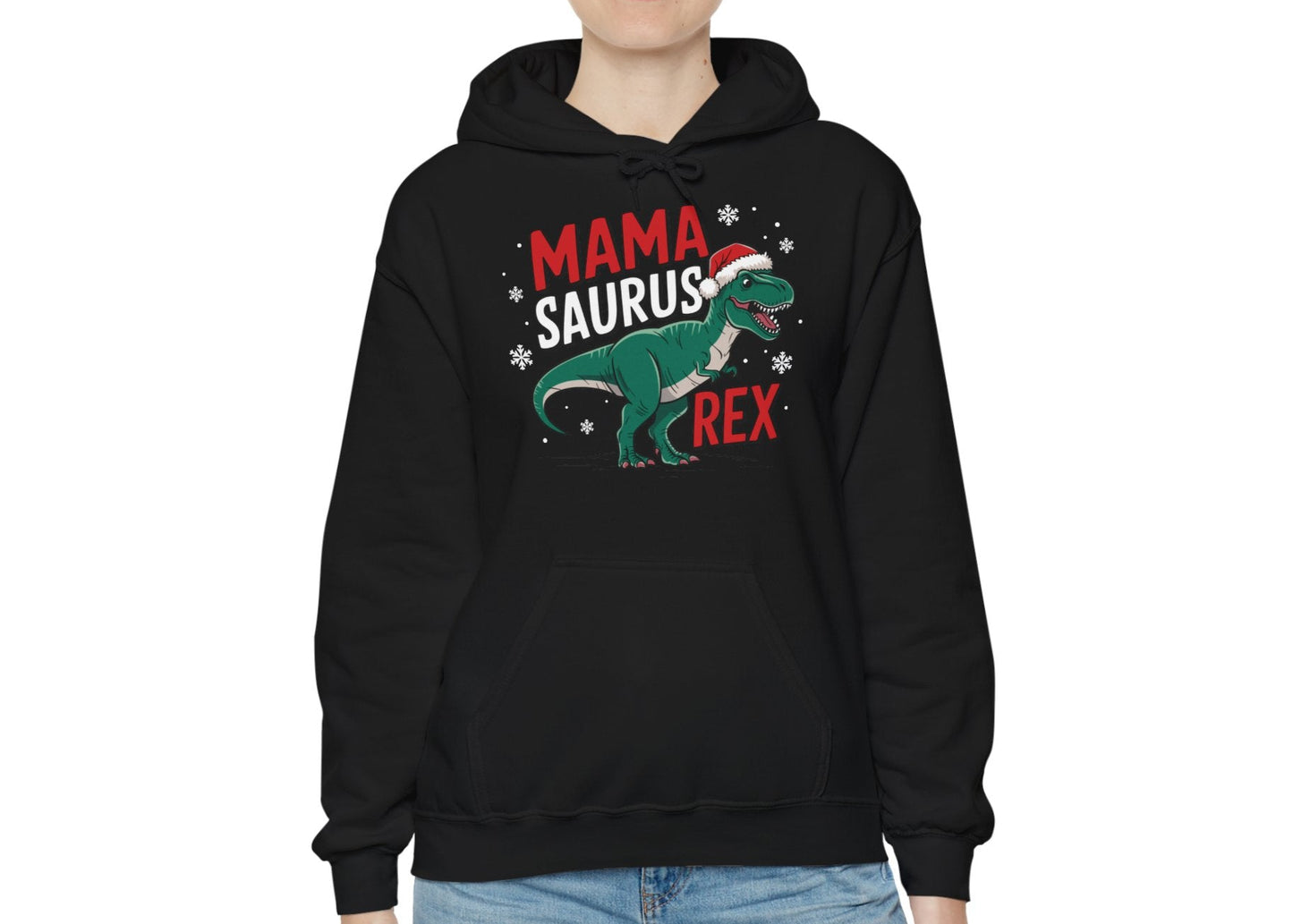 Model wearing a black hoodie featuring a "Mama-Saurus Rex" design with a festive dinosaur illustration, styled casually. Part of the Vivid Divergence Sensory Friendly Unisex Hoodie Range