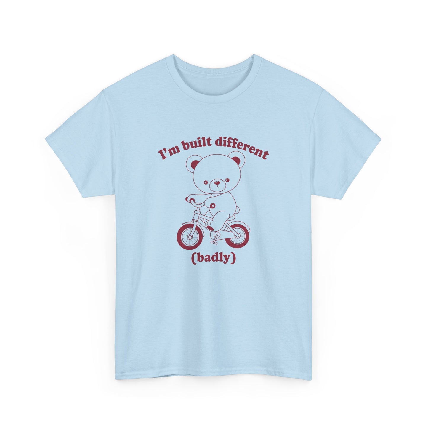 Front view of a blue T-shirt featuring the "Built Different (Badly)" bear design. Part of the Vivid Divergence Sensory Friendly Unisex Tees Range.