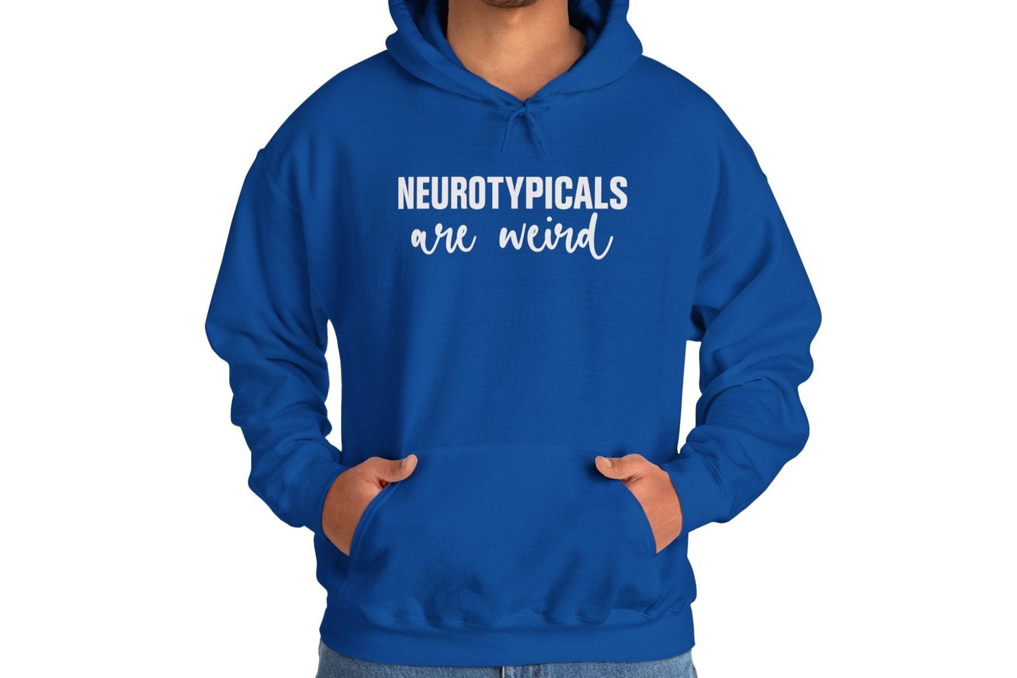 Model wearing a blue hoodie featuring the text "Neurotypicals Are Weird" in bold white lettering. Part of the Vivid Divergence Sensory Friendly Unisex Hoodie Range.