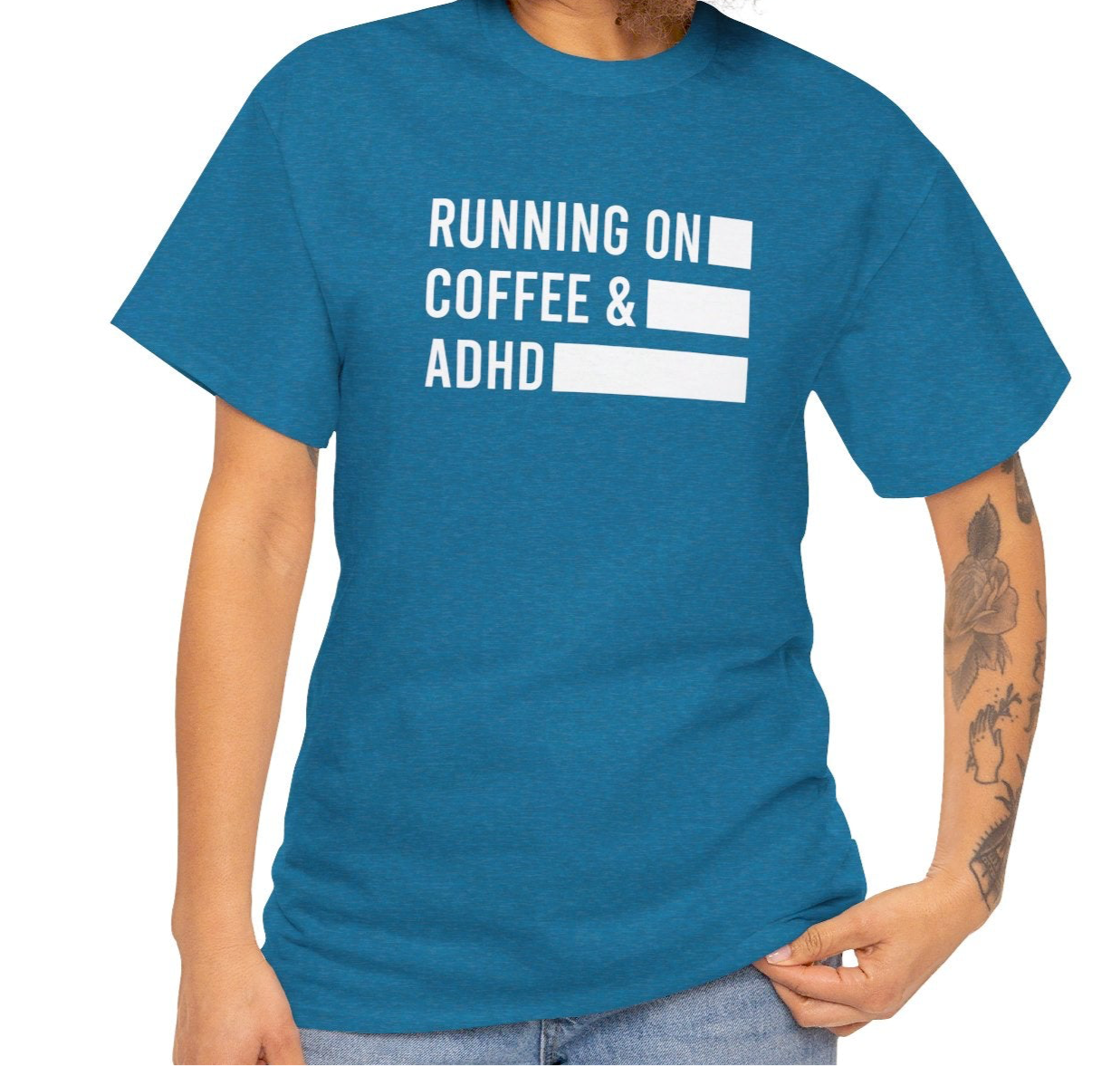 Model wearing a blue T-shirt with "Running on Coffee & ADHD" in bold white text. Part of the Vivid Divergence Sensory Friendly Unisex Tees Range.
