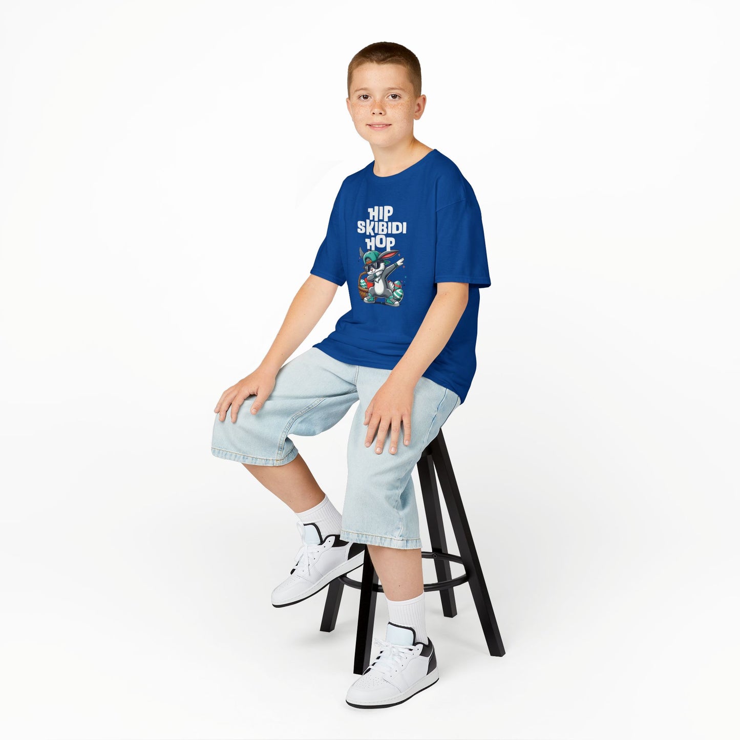 Child wearing a blue Easter T-shirt with a Skibidi bunny doing a hip-hop dab, perfect for a fun and festive Easter. Hop into the season in style and shop Easter shirts online today!