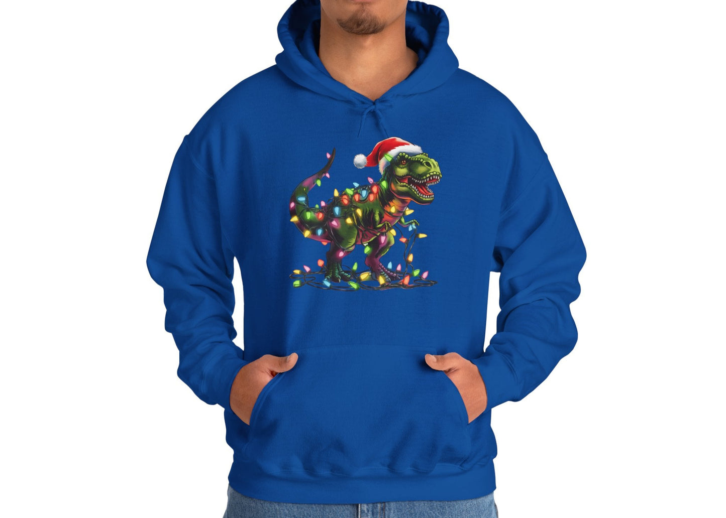 Model wearing a blue hoodie with a playful T-Rex tangled in Christmas lights, wearing a Santa hat. Part of the Vivid Divergence Sensory Friendly Hoodie Range.