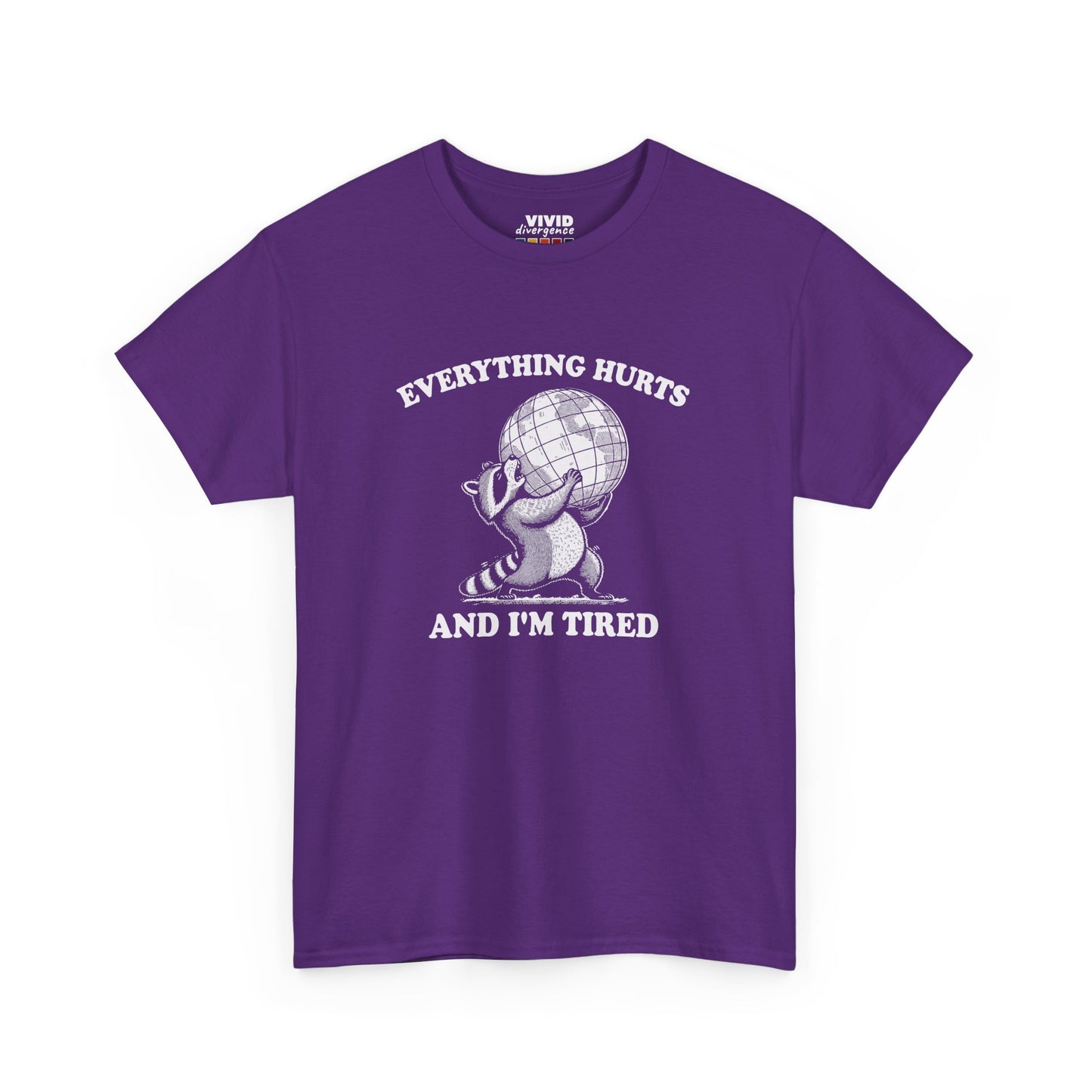 Front view of purple T-shirt featuring a vintage style sketch of a raccoon carrying the world with the phrase “Everything Hurts and I’m Tired.” The official uniform of burnt out. Part of the Vivid Divergence Memewear Collection!