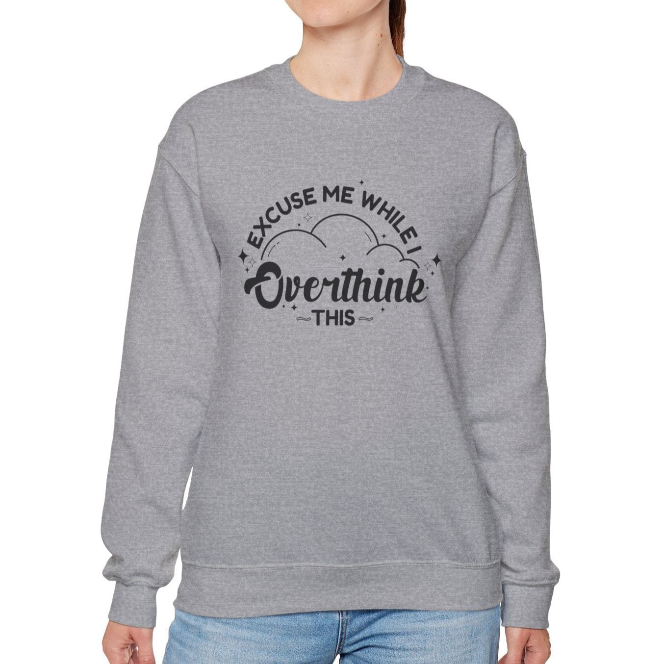 Model wearing a gray sweater jumper with the text "Excuse Me While I Overthink This" in black lettering. Part of the Vivid Divergence Sensory Friendly Unisex Sweater Jumper Range.