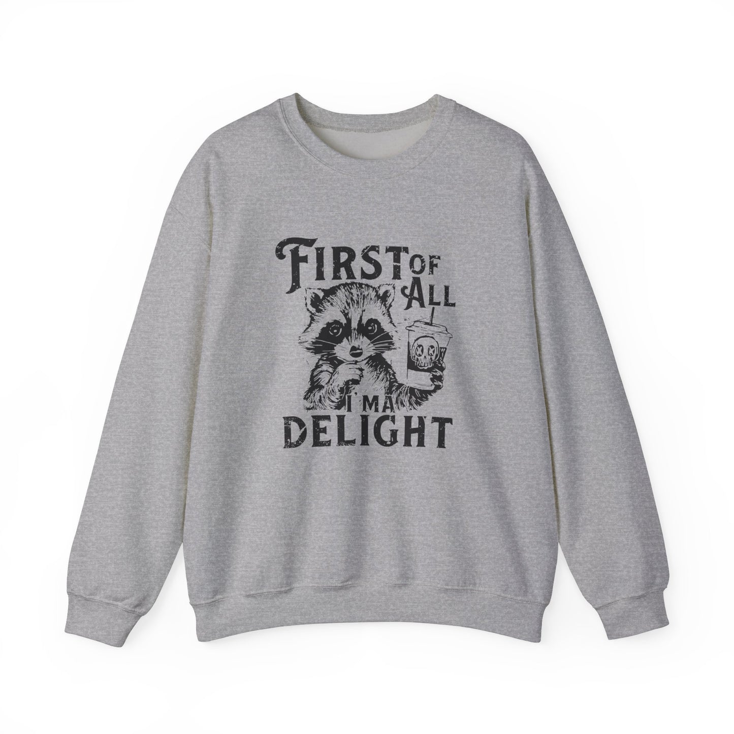 Front view of a gray sweater jumper with the text "First of All, I’m a Delight" and a cartoon raccoon illustration. Part of the Vivid Divergence Sensory Friendly Unisex Sweater Jumper Range.