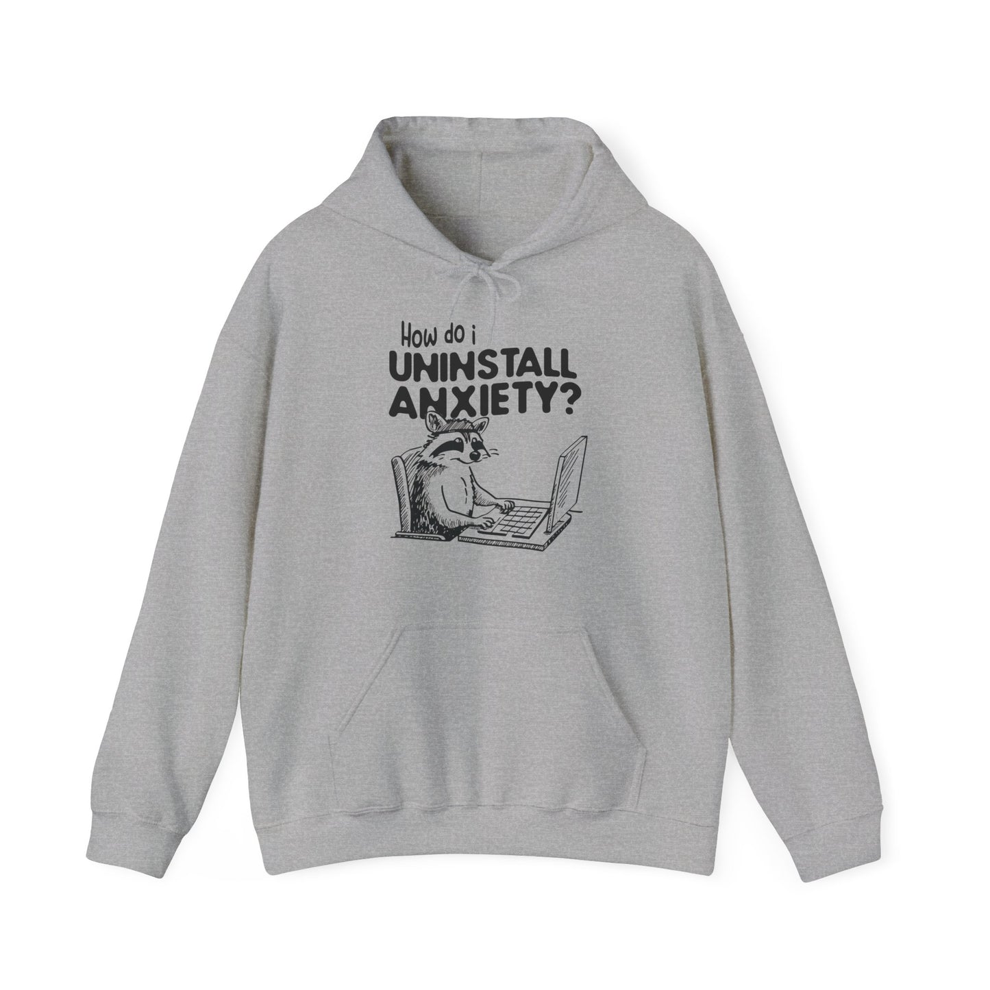 Front view of a gray hoodie featuring the text "How Do I Uninstall Anxiety?" and a cartoon illustration of a raccoon using a laptop. Part of the Vivid Divergence Sensory Friendly Unisex Hoodie Range.