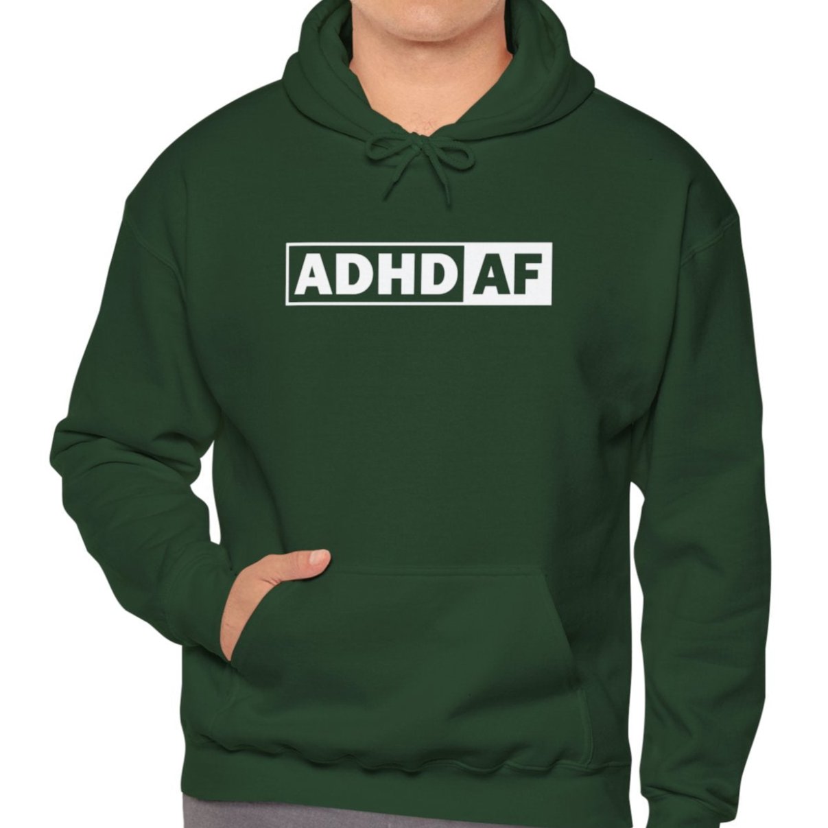 Model wearing a green hoodie with the text "ADHD AF" in bold white lettering inside a rectangular border. Part of the Vivid Divergence Sensory Friendly Unisex Hoodie Range.