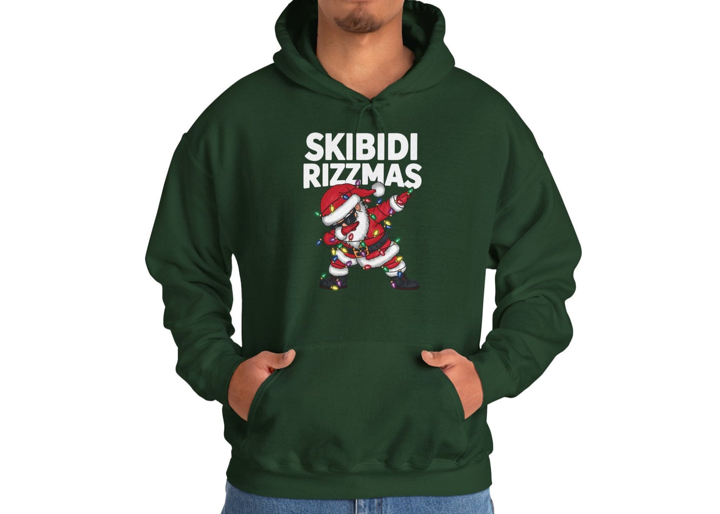 Model wearing a green "Skibidi Rizzmas" hoodie, showing the front design with Santa dabbing. Part of the Vivid Divergence Sensory Friendly Unisex Hoodies Range.