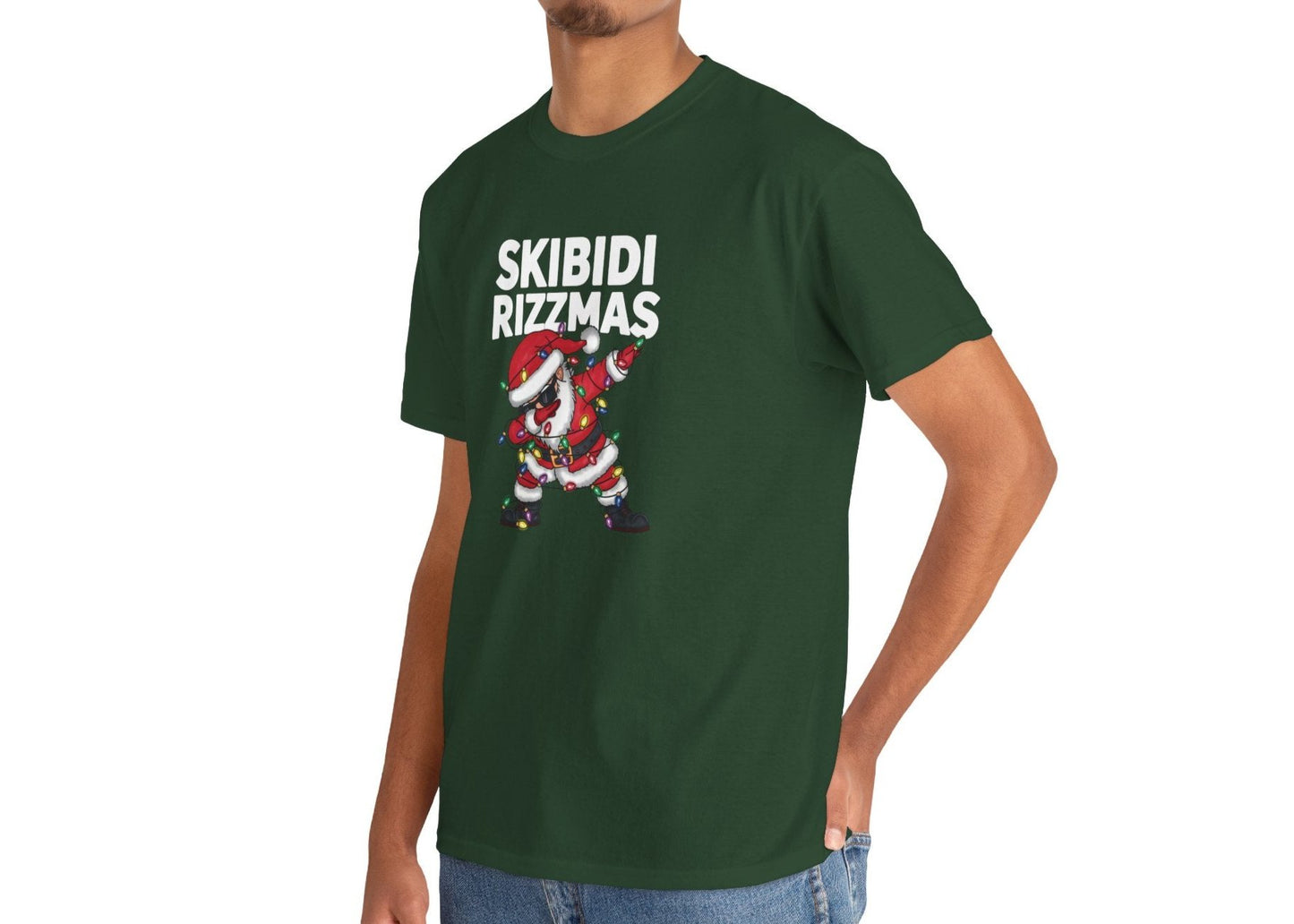 Model wearing a green T-shirt featuring a dabbing Santa and "Skibidi Rizzmas" text. Part of the Vivid Divergence Sensory Friendly Unisex Tees Range.