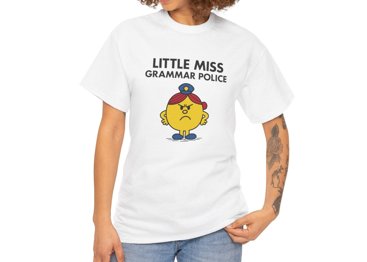Person wearing the Little Miss Grammar Police T-shirt with jeans. Part of the Little Miss Meme Character Collection. A Vivid Divergence Sensory Friendly Unisex Tee.