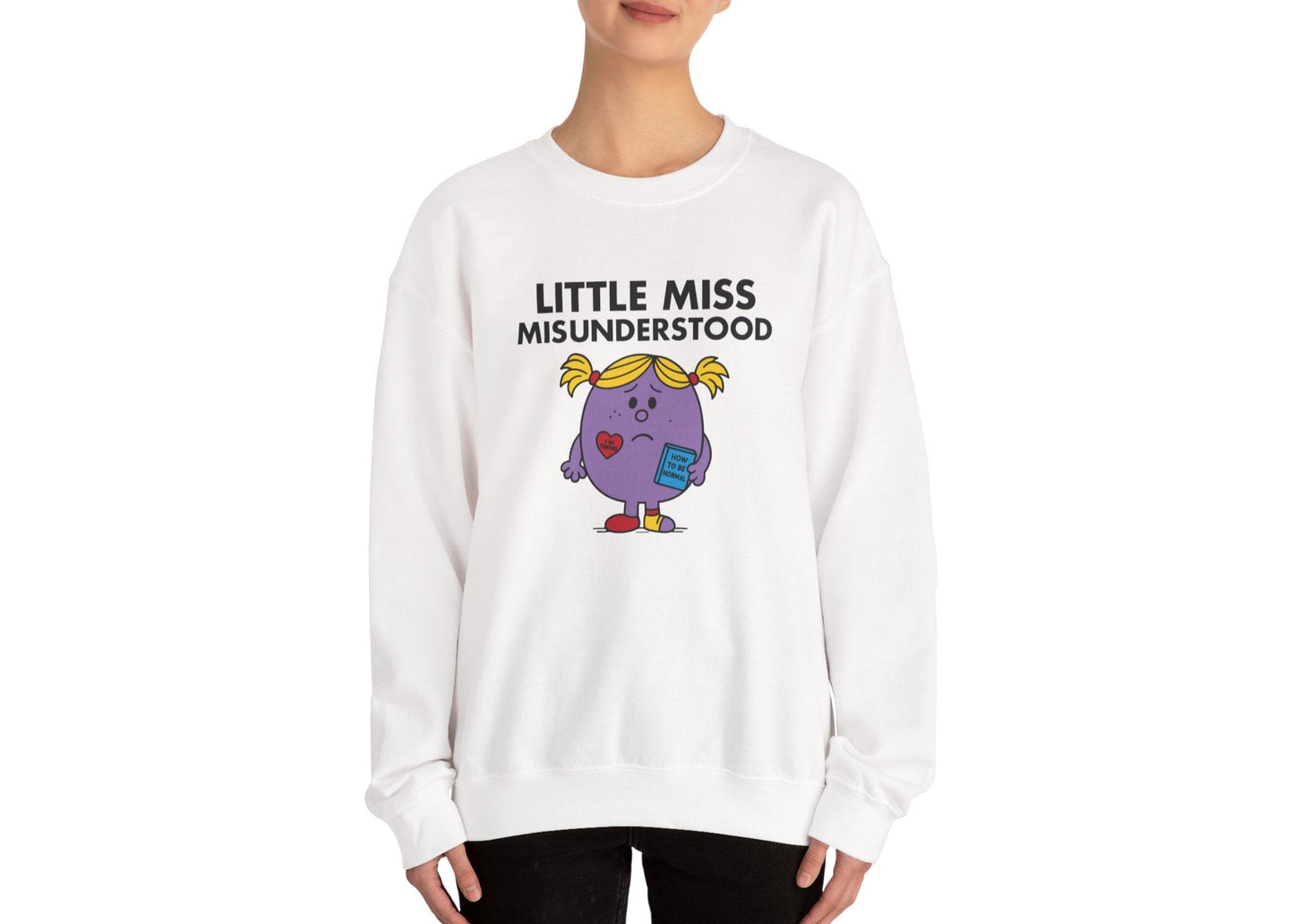 Person wearing the Little Miss Misunderstood sweatshirt in a neutral pose. Part of the Little Miss Meme Character Collection. A Vivid Divergence Sensory Friendly Sweater Jumper.