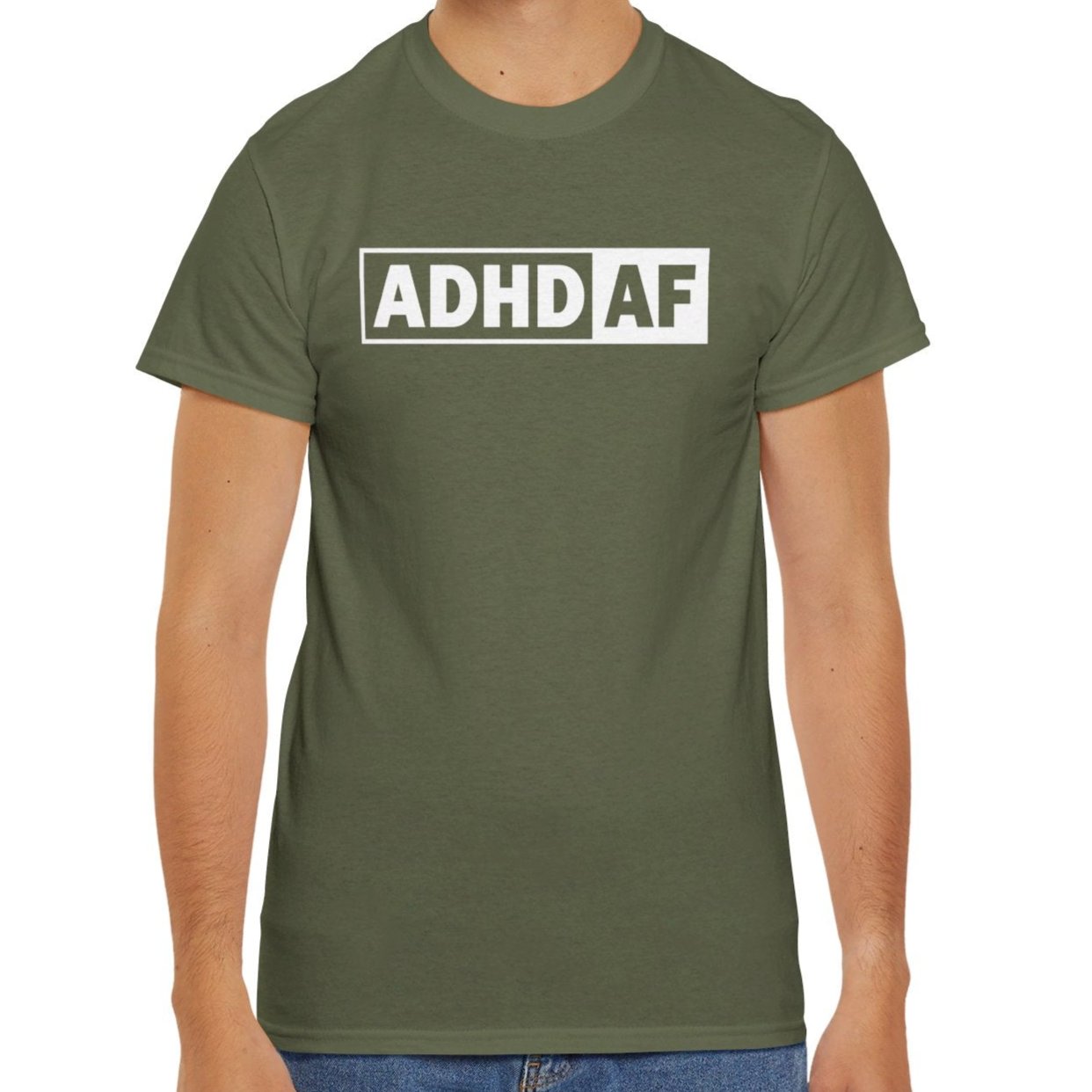 Model wearing a military green T-shirt with bold "ADHD AF" text. Part of the Vivid Divergence Sensory Friendly Unisex Tees Range.
Image Name: