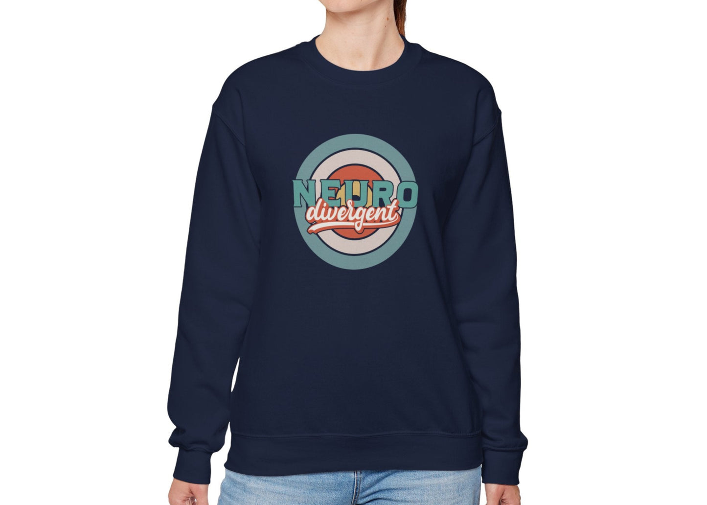 Model wearing a navy blue sweatshirt with a retro-style circular target design and the word "Neurodivergent," standing with hands at sides. Part of the Vivid Divergence Sensory Friendly Unisex Sweater Jumper Range.