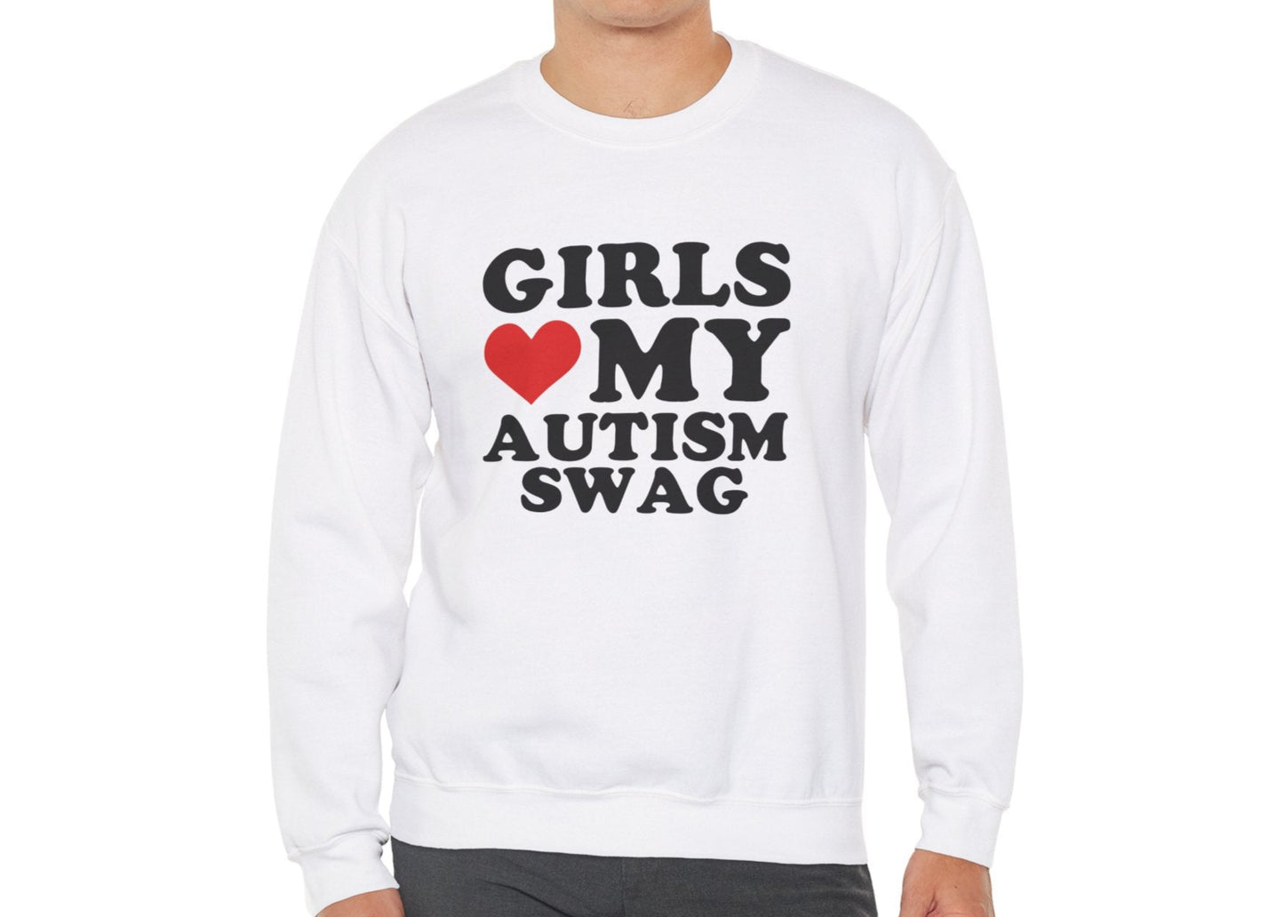Model wearing a white sweatshirt with bold black text that reads "Girls ❤️ My Autism Swag," standing with hands at sides. Part of the Vivid Divergence Sensory Friendly Unisex Sweater Jumper Range.