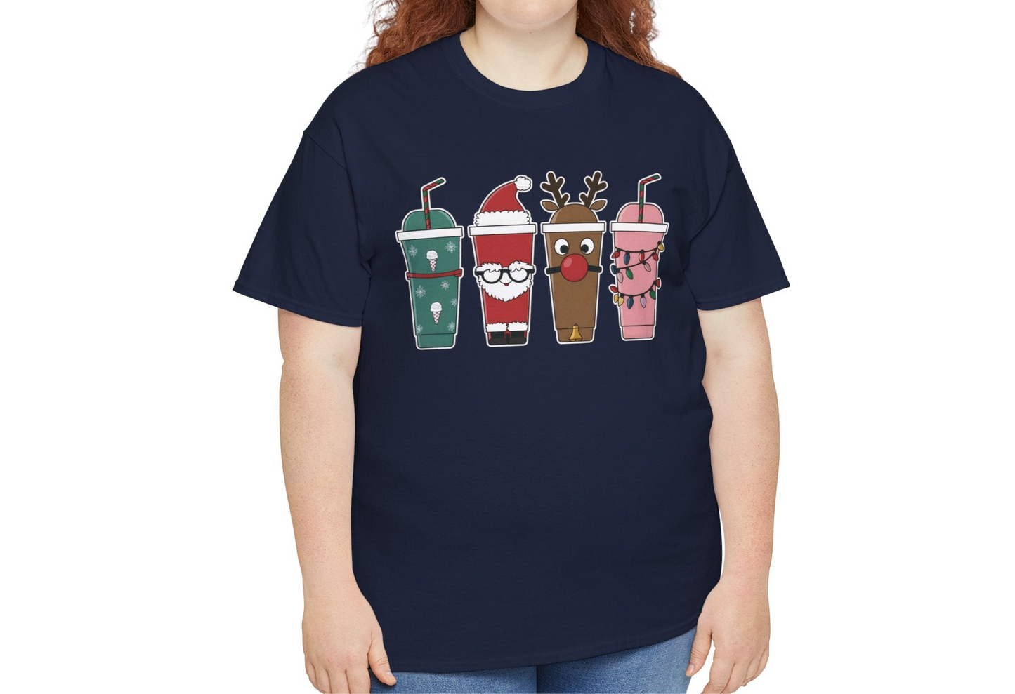 Model wearing a navy blue T-shirt featuring Christmas-themed iced coffee cup illustrations, styled casually with jeans. Part of the Vivid Divergence Sensory Friendly Unisex Tees Range.
