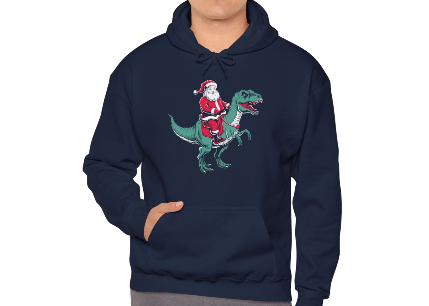 Model wearing a navy blue hoodie featuring Santa riding a dinosaur in a festive holiday design. Part of the Vivid Divergence Sensory Friendly Unisex Hoodie Range.