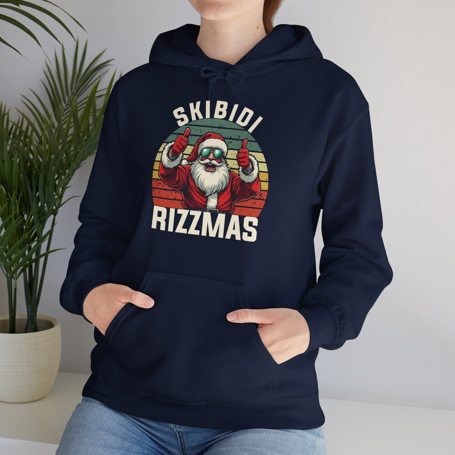 Model wearing a navy blue hoodie featuring a retro-style Skibidi Rizzmas Christmas print. Part of the Vivid Divergence Sensory Friendly Unisex Hoodies Range.