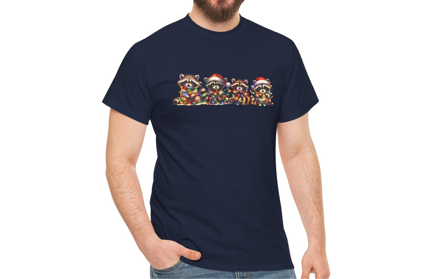 Model wearing a navy blue T-shirt featuring a festive illustration of raccoons in Christmas attire causing holiday chaos, styled casually. Part of the Vivid Divergence Sensory Friendly Unisex Tees Range.