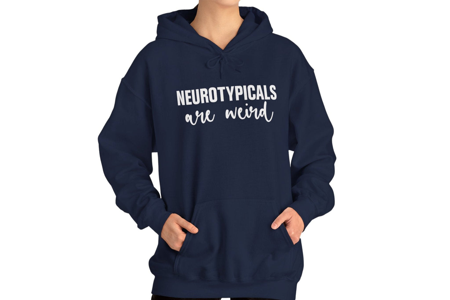 Model wearing a navy blue hoodie featuring the text "Neurotypicals Are Weird" in bold white lettering. Part of the Vivid Divergence Sensory Friendly Unisex Hoodie Range.