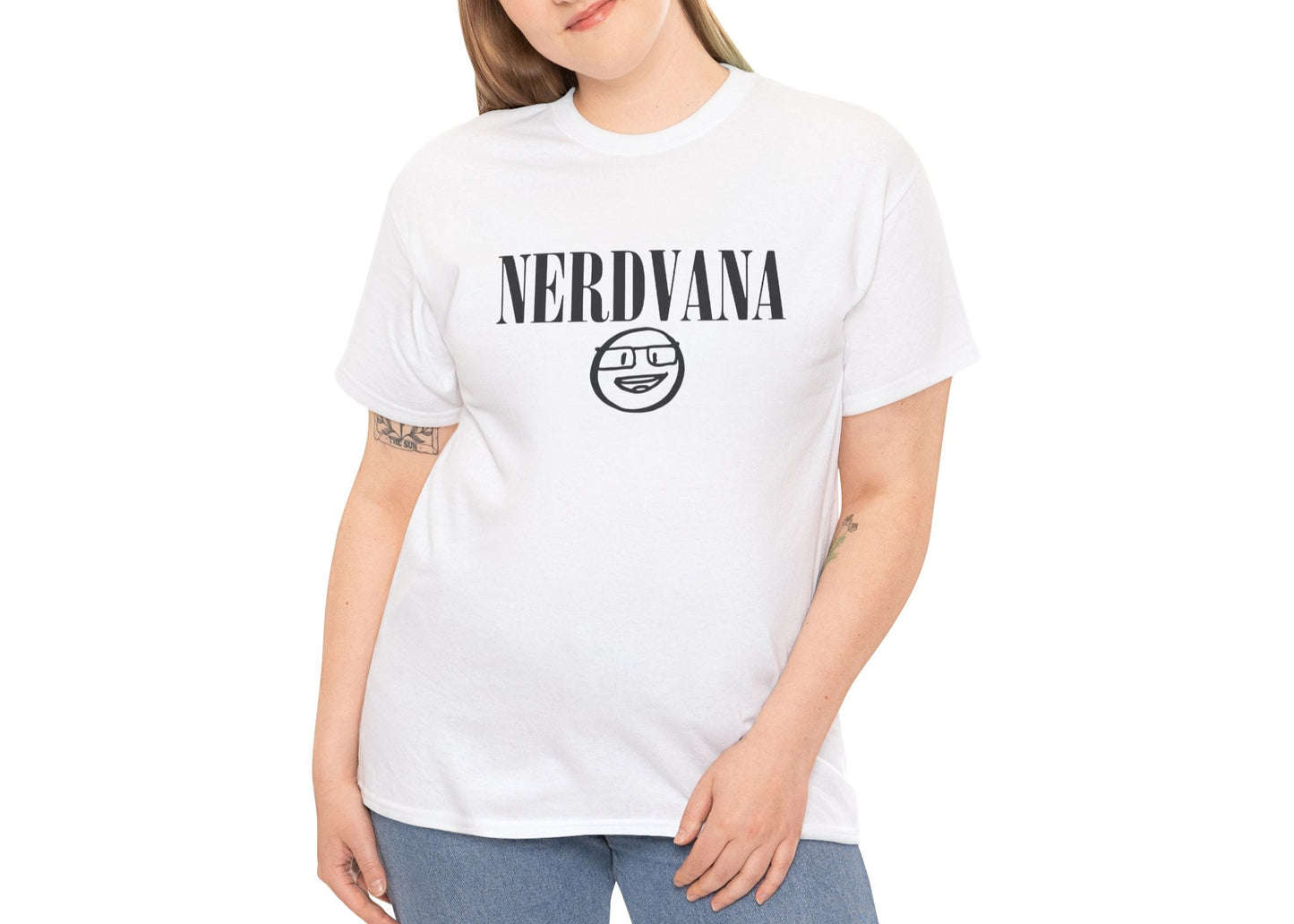 Modeled view of white T-shirt with bold black text reading “NERDVANA” above a circular parody logo combining geek symbols and grunge vibes. For fans of riffs and references. Part of the Vivid Divergence Memewear Collection!