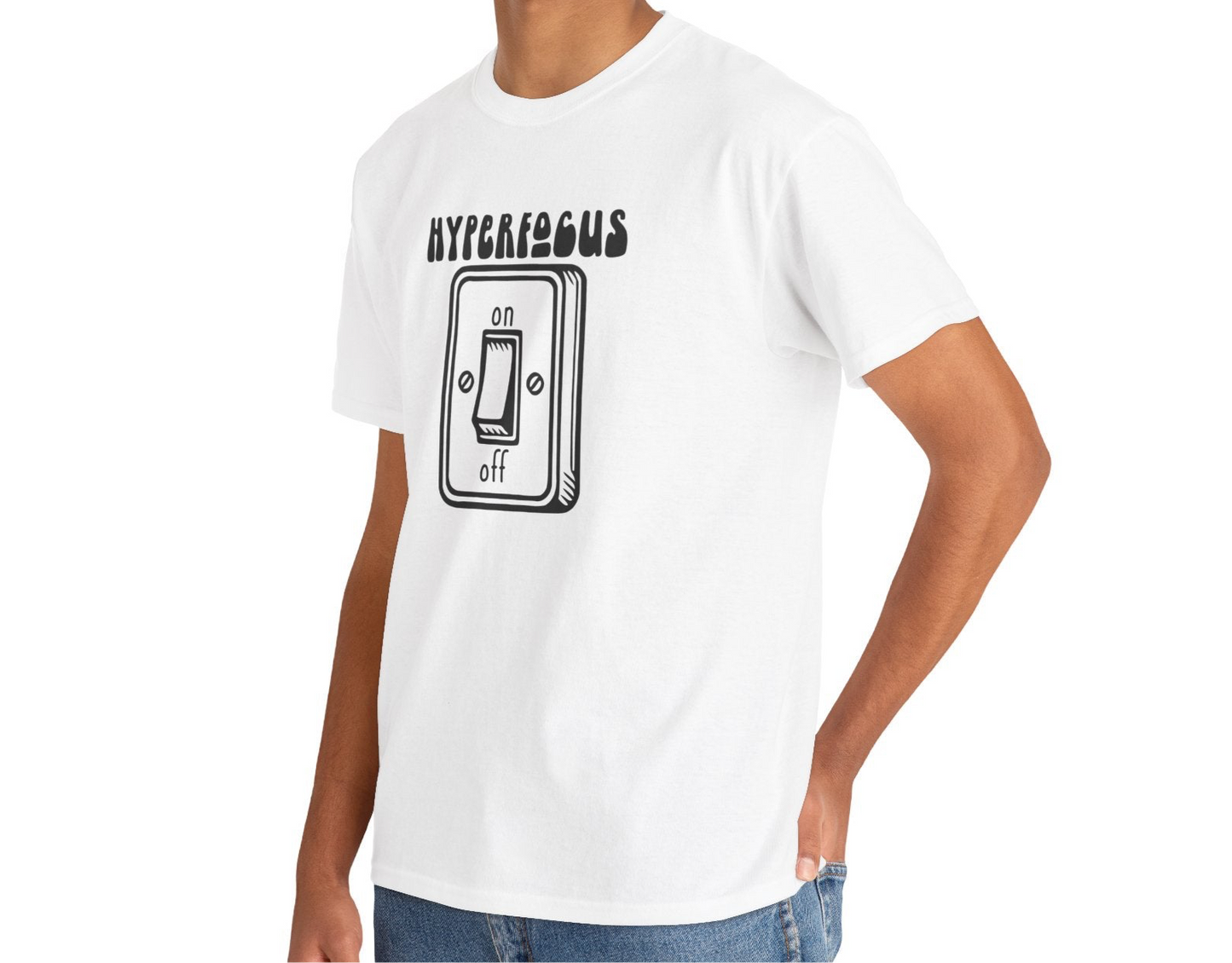 A person wearing a white T-shirt with the text "Hyperfocus" and an on/off switch graphic design. Part of the Vivid Divergence Sensory Friendly Unisex Tees Range.