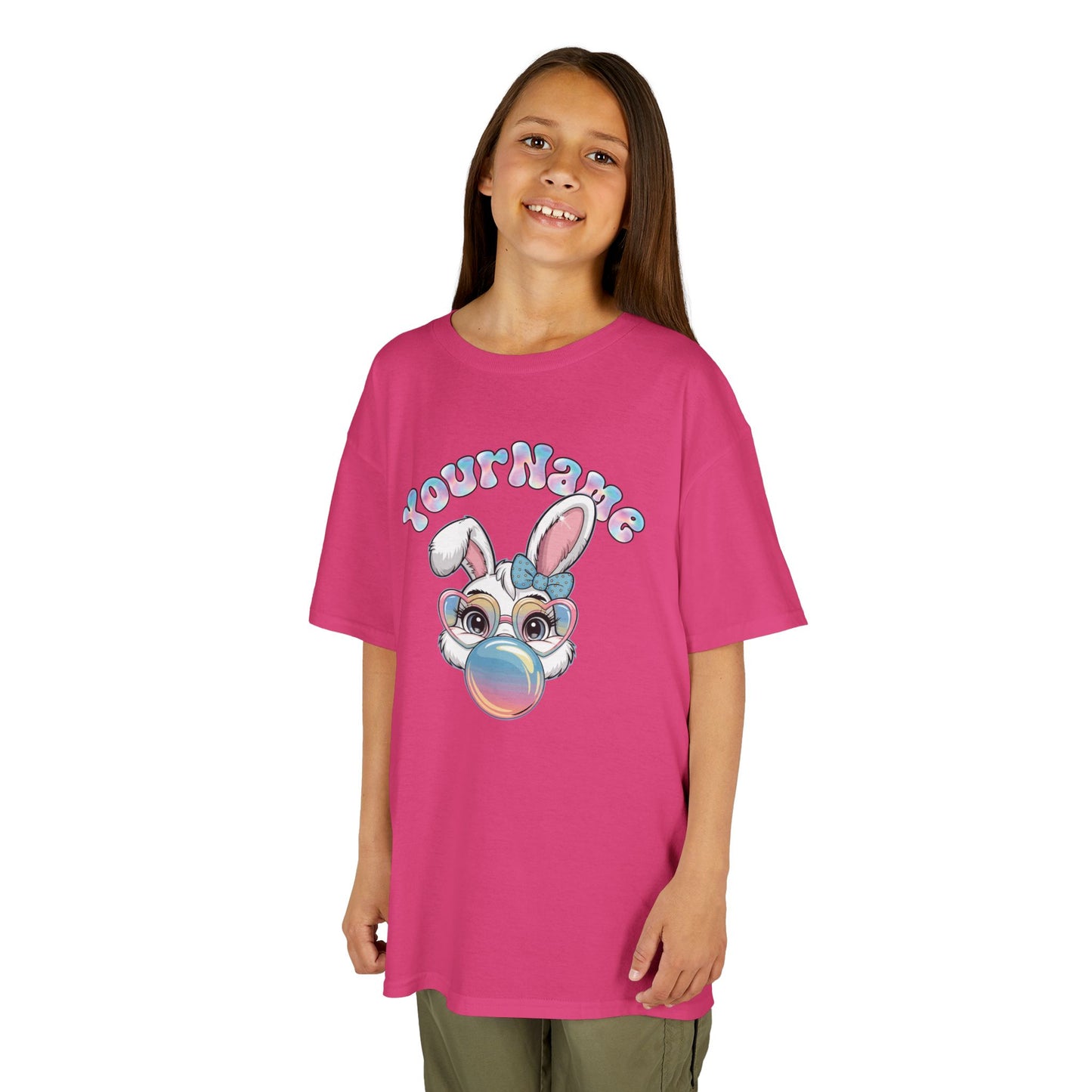 Child wearing a pink Easter T-shirt with a bunny blowing bubblegum, customizable with your child's name. Looking for the perfect Easter shirts for kids? Whether you’re shopping for Easter shirts for boys, Easter shirts for girls, or Easter shirts for toddlers, we’ve got festive and fun options for everyone! Hop into the season in style and shop Easter shirts online today!