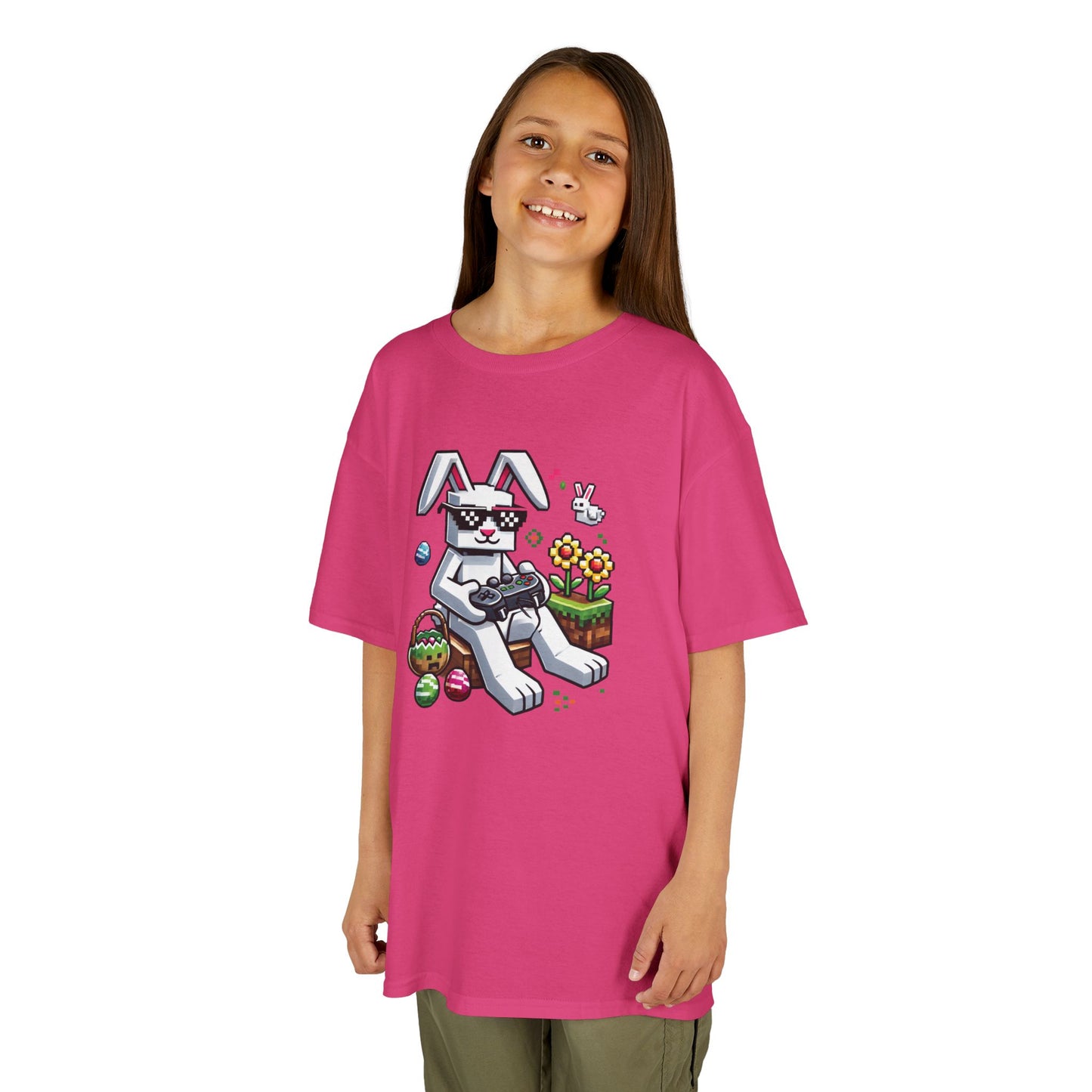 Child wearing a pink Easter T-shirt with a blocky bunny and colorful eggs, perfect for young gamers. Hop into the season in style and shop Easter shirts online today!