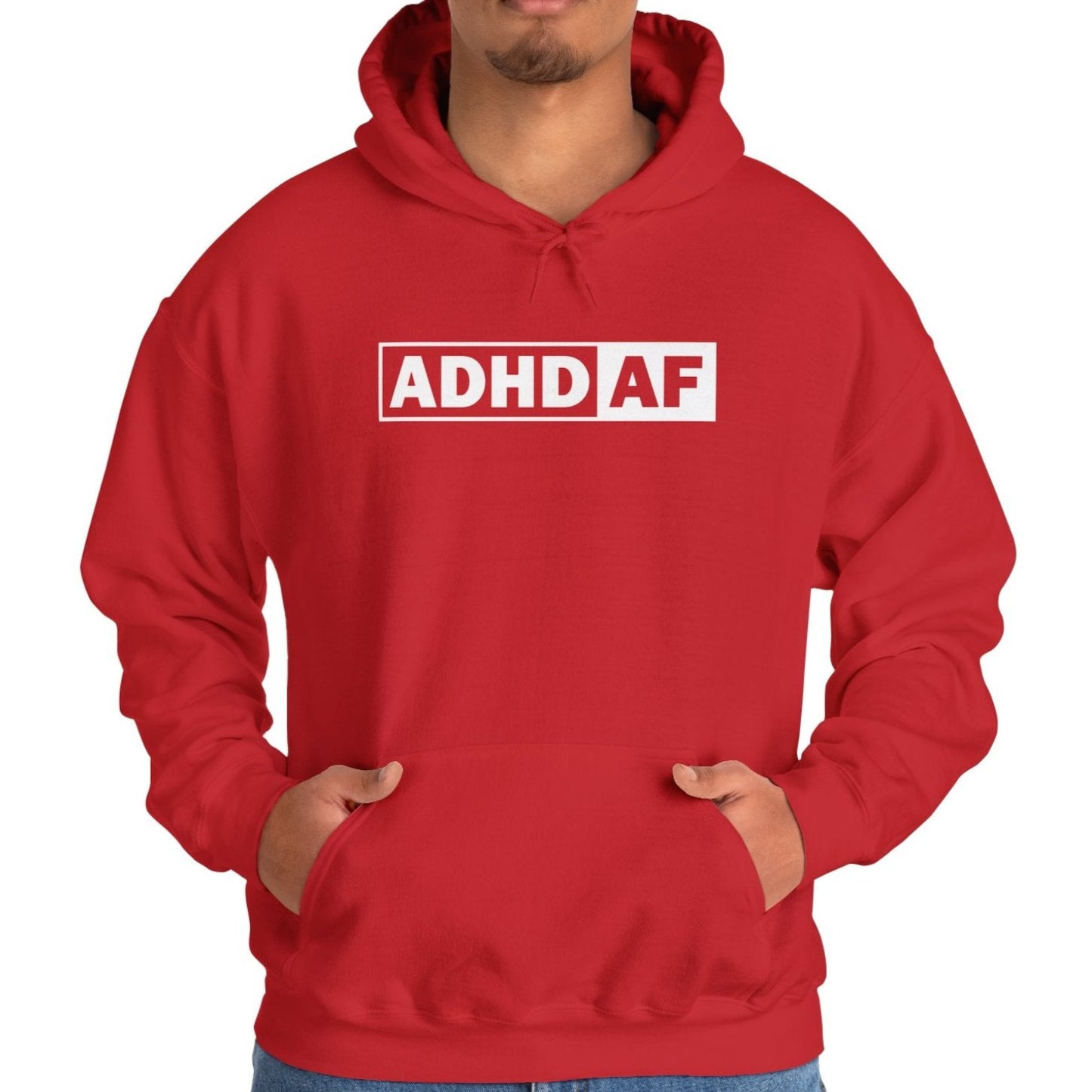 Model wearing a red hoodie with the text "ADHD AF" in bold white lettering inside a rectangular border. Part of the Vivid Divergence Sensory Friendly Unisex Hoodie Range.