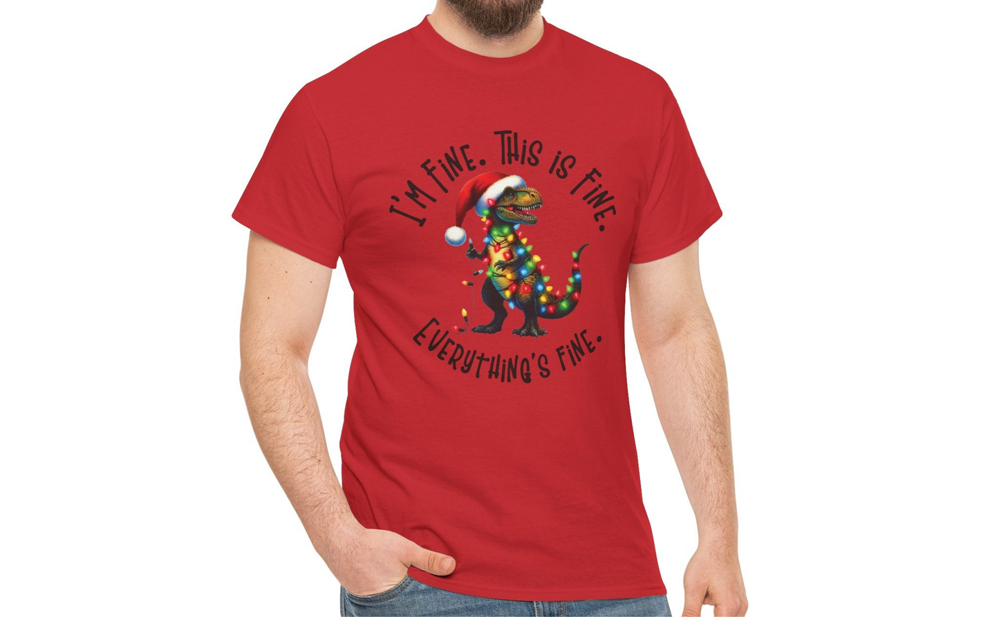 Model wearing an red T-shirt featuring a festive illustration of a dinosaur tangled in Christmas lights with the text "I’m Fine. This is Fine. Everything is Fine," styled casually. Part of the Vivid Divergence Sensory Friendly Unisex Tees Range.
