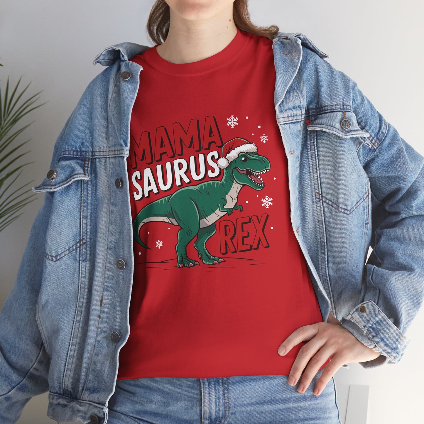 Model wearing a red T-shirt featuring a "Mama-Saurus Rex" design with a festive dinosaur illustration, styled casually with a denim jacket. Part of the Vivid Divergence Sensory Friendly Unisex Tees Range.