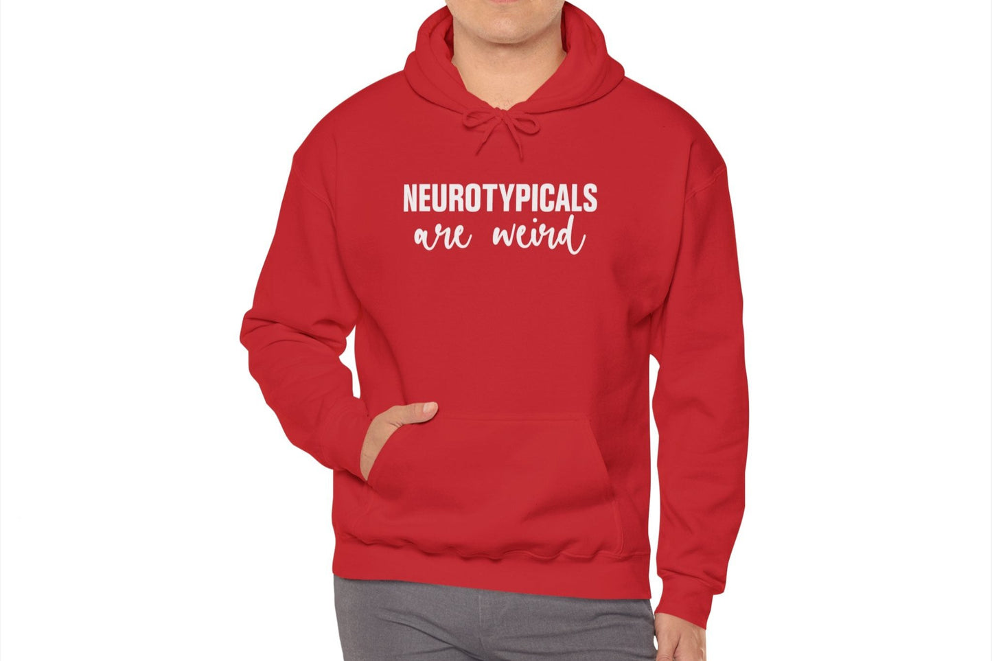 Model wearing a red hoodie featuring the text "Neurotypicals Are Weird" in bold white lettering. Part of the Vivid Divergence Sensory Friendly Unisex Hoodie Range.