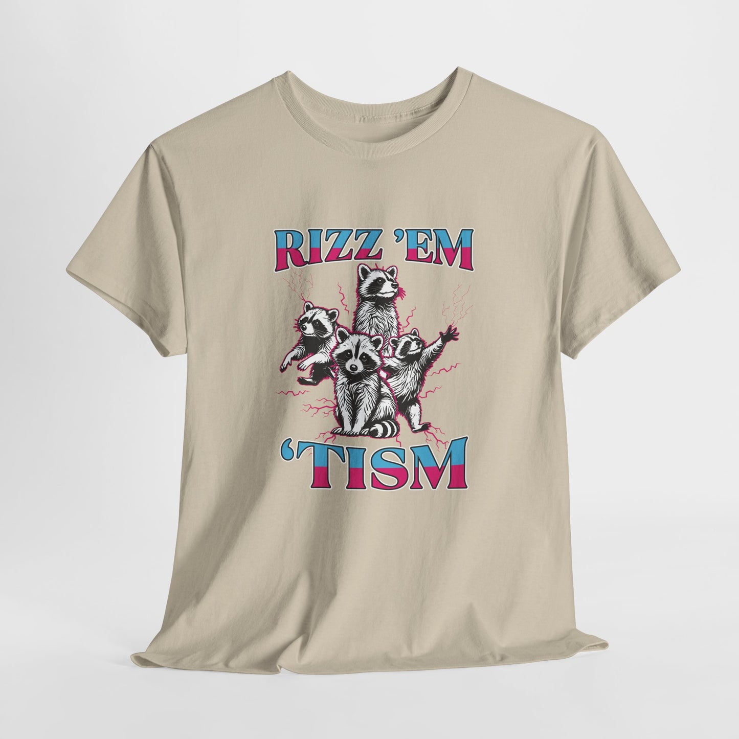 Front view of a beige T-shirt featuring a raccoon illustration with the phrase "RIZZ 'EM 'TISM" in bold blue and pink text. Part of the Vivid Divergence Sensory Friendly Unisex Tees Range.