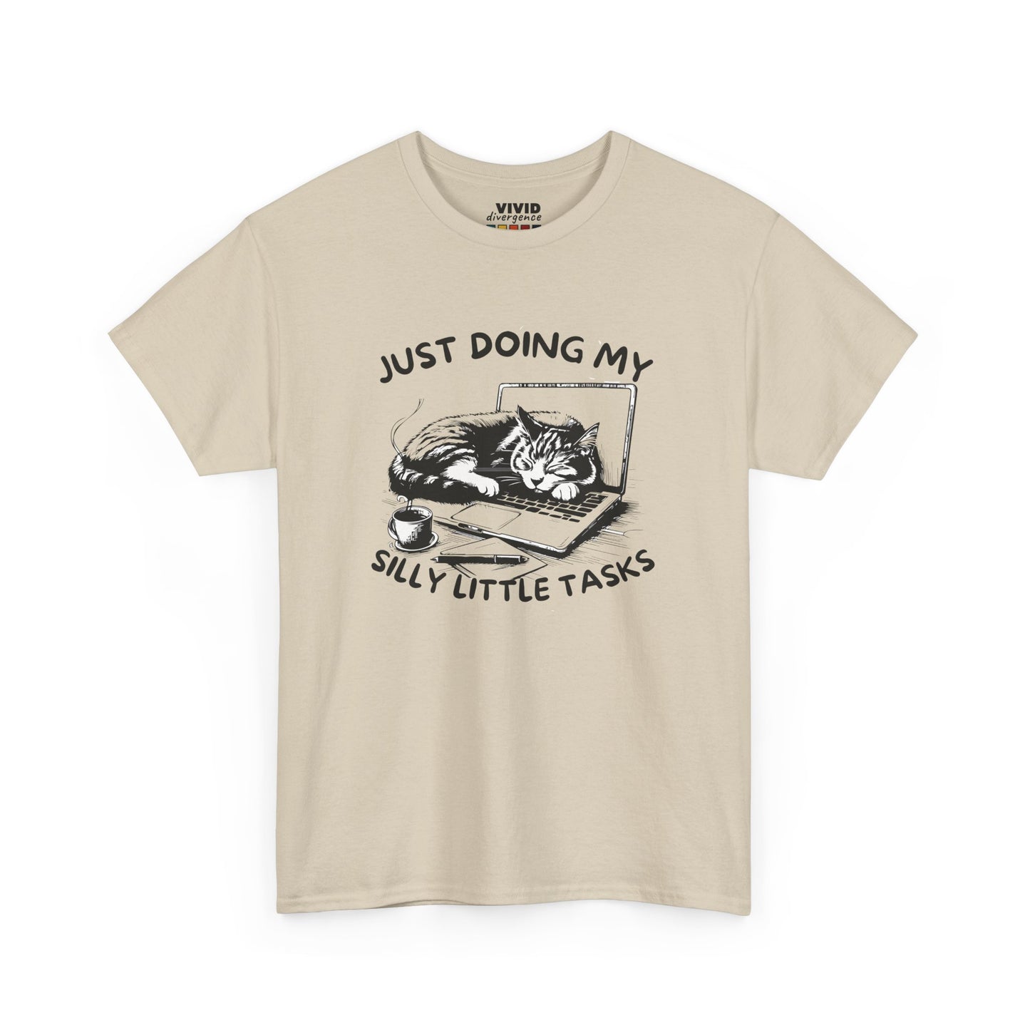 Front view of beige T-shirt featuring lounging cat on a laptop with meme text above. Absolutely not multitasking. Part of the Vivid Divergence Memewear Collection!