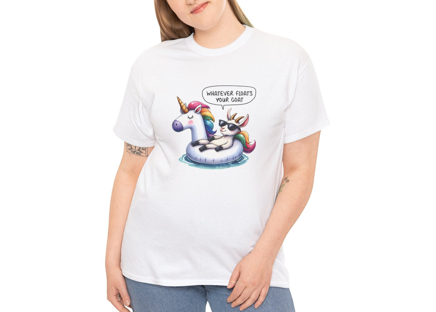 Woman modeling the Whatever Floats Your Goat T-shirt, smiling with hands in pockets. She’s carefree and slightly feral. Part of the Vivid Divergence Memewear Collection!
