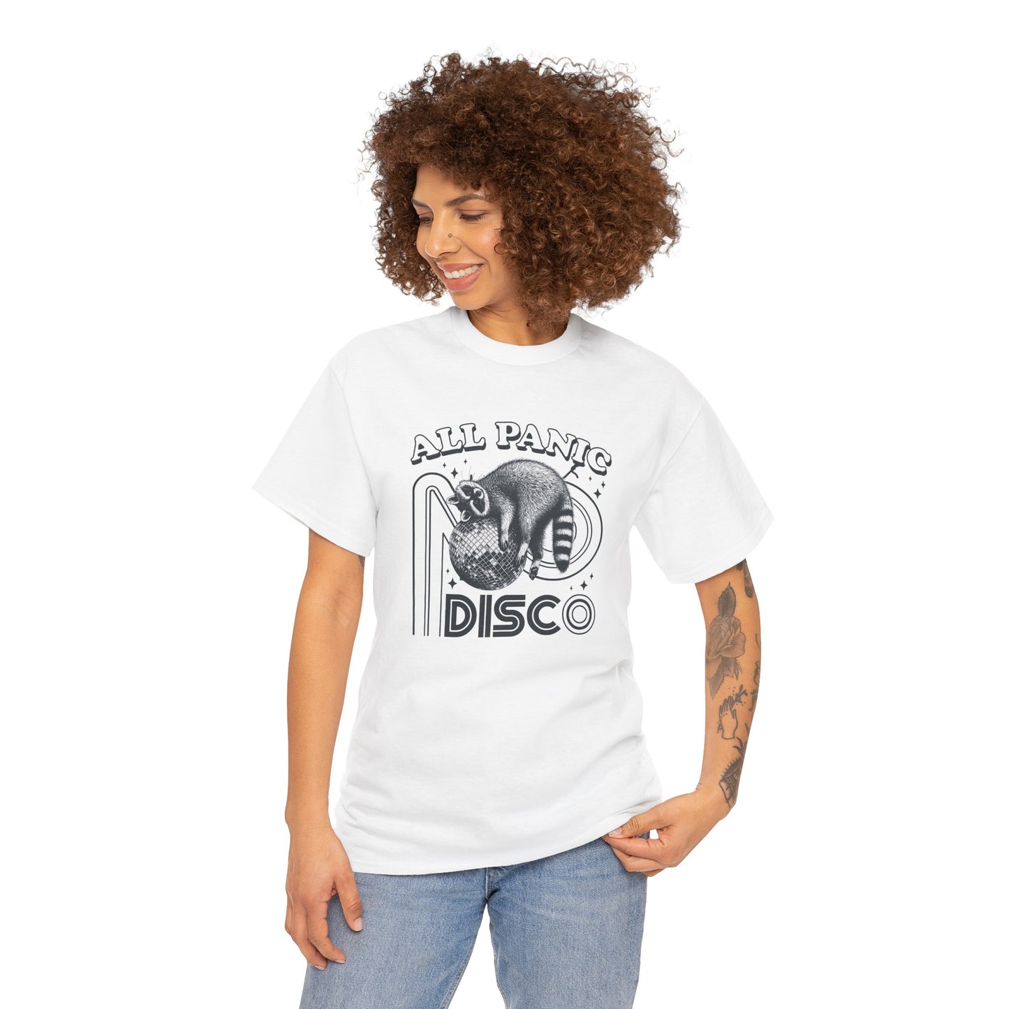 Model wearing a white T-shirt featuring "All Panic No Disco" text with a raccoon illustration inside a disco ball. Part of the Vivid Divergence Sensory Friendly Unisex Tees Range.