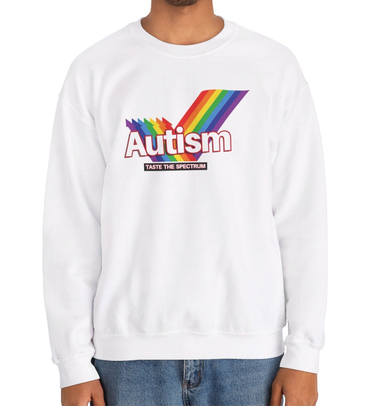 Model wearing a white sweater jumper with an "Autism" Skittles brand parody design featuring rainbow stripes. Part of the Vivid Divergence Sensory Friendly Unisex Sweater Jumper Range.