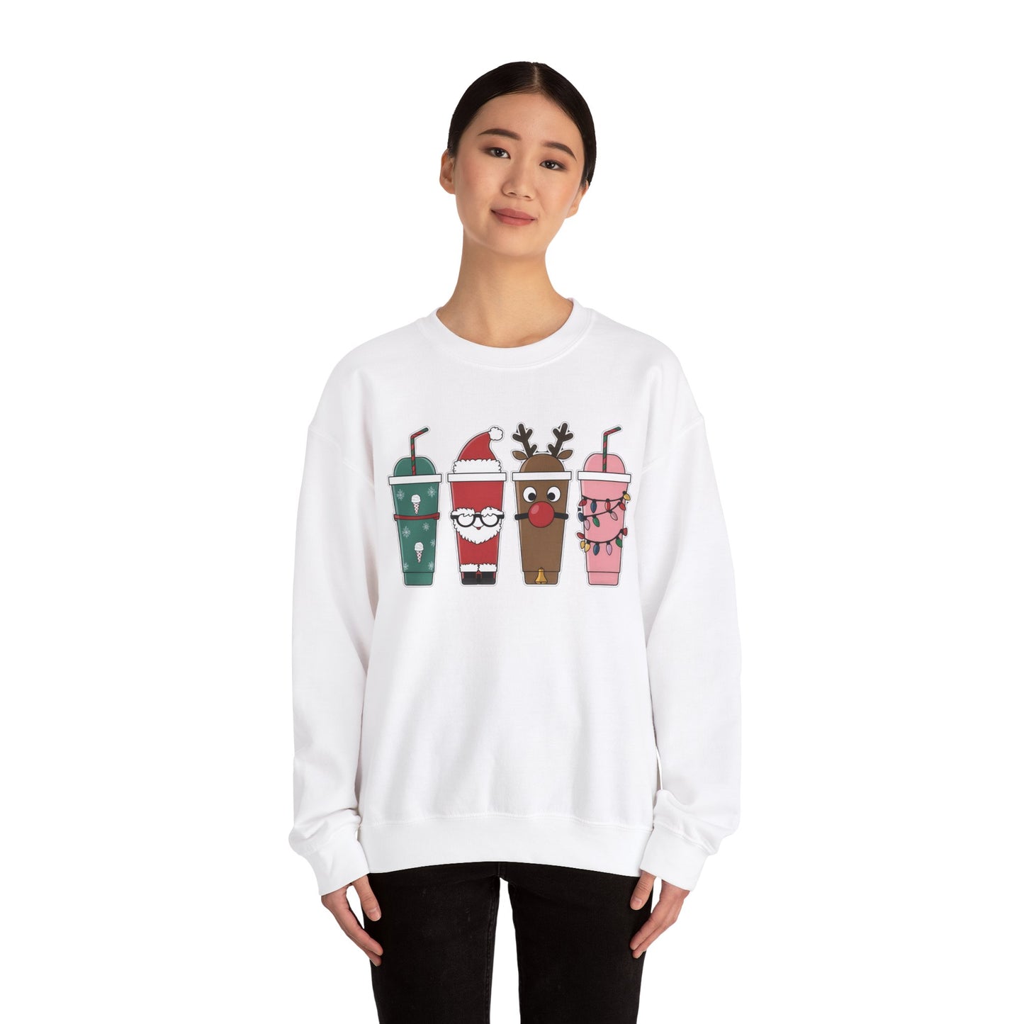 Model wearing a white sweatshirt featuring a festive illustration of four iced coffee cups decorated with Christmas designs, including reindeer, Santa, and holiday patterns. Part of the Vivid Divergence Sensory Friendly Unisex Sweater Jumper Range.